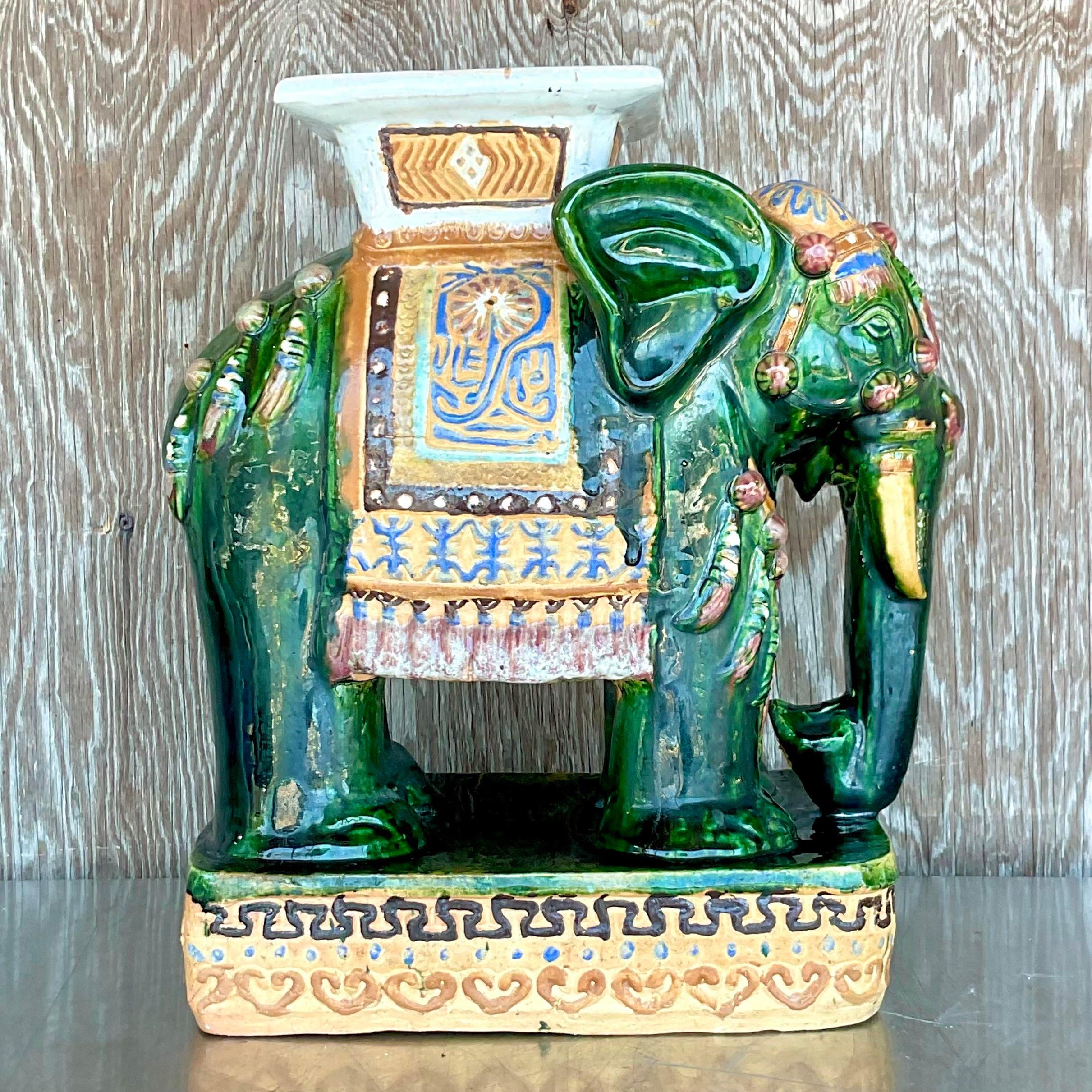 A fabulous vintage Boho stool. A chic glazed ceramic elephant in brilliant jewel tones. Hand painted. Acquired from a Palm Beach estate. 