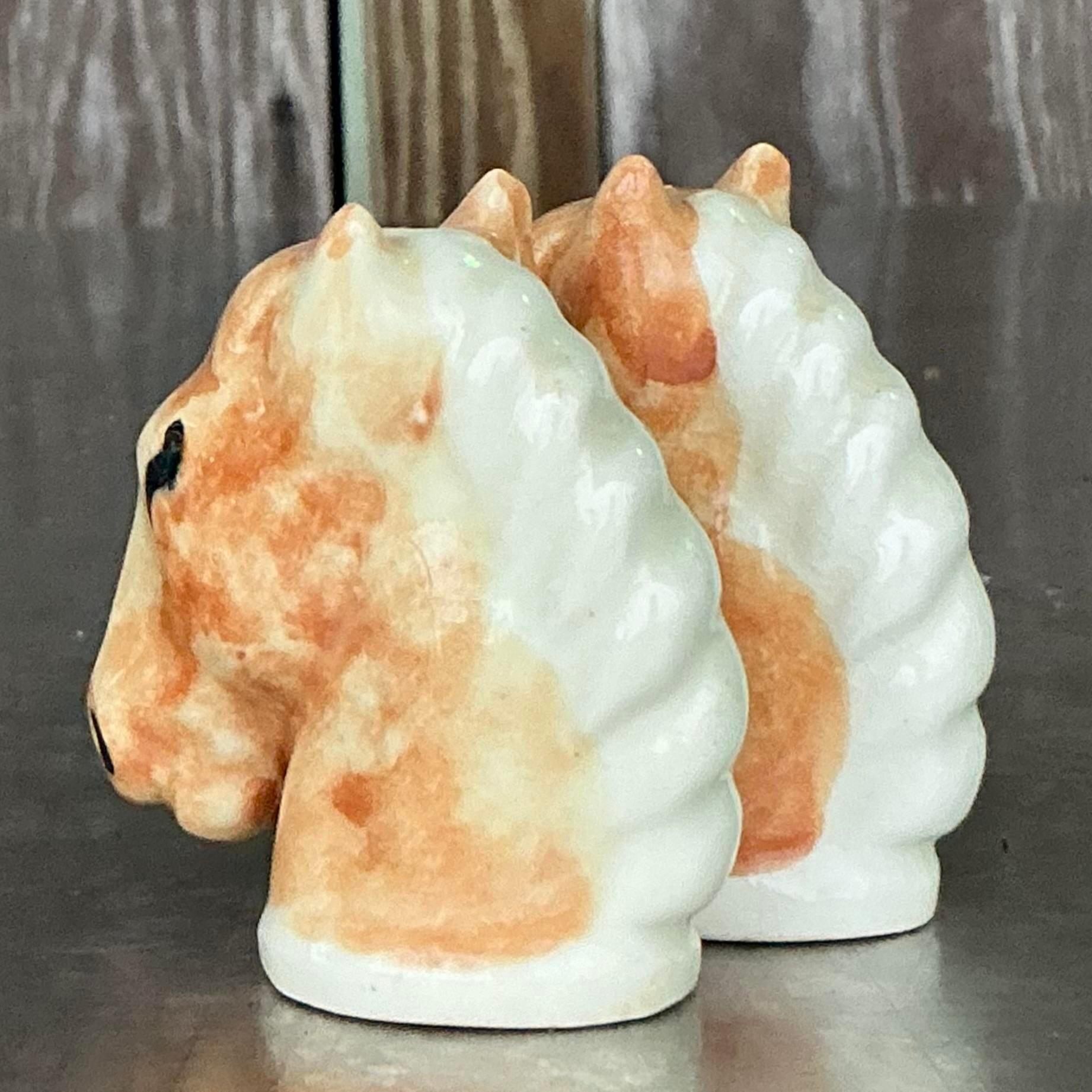 Add a touch of rustic charm to your table with this pair of Vintage Boho Glazed Ceramic Horse Salt and Pepper Shakers. Expertly crafted and hand-glazed, these unique shakers bring a playful yet elegant flair to any dining setting. Perfect for horse