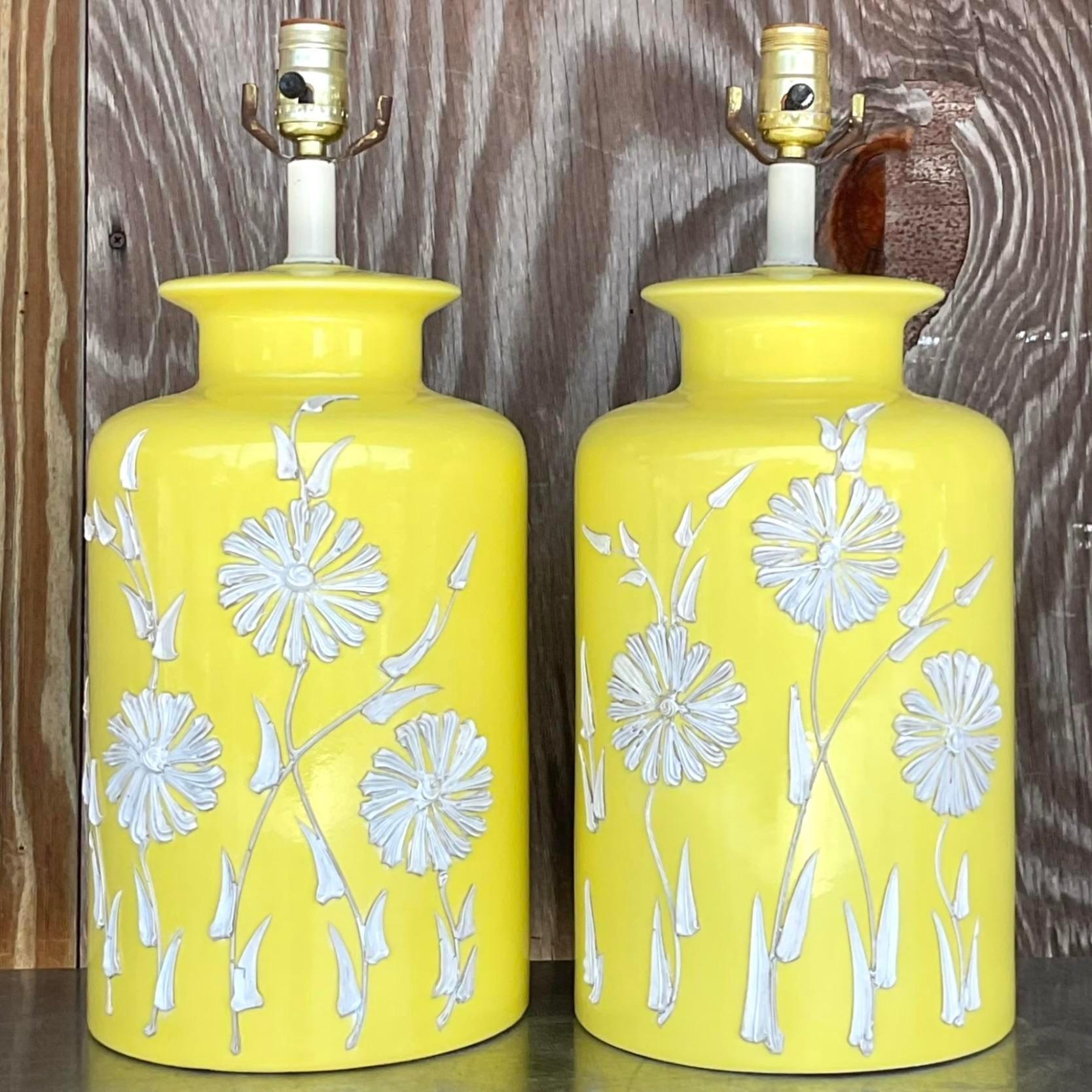 A fabulous pair of vintage Boho table lamps. A brilliant yellow glazed ceramic with a floral icing design. Acquired from a Palm Beach estate.