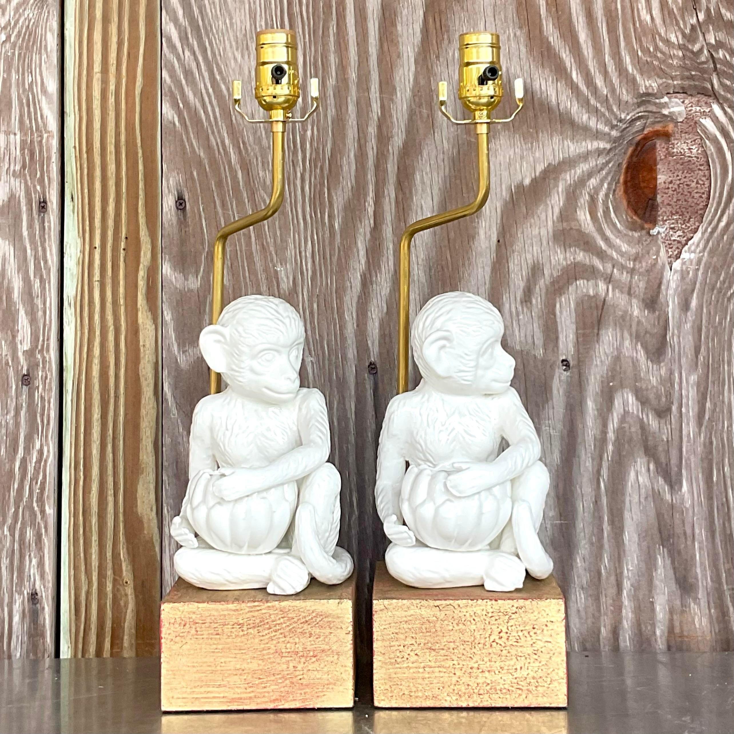 Add a touch of playful elegance to your space with this pair of vintage boho glazed ceramic monkey lamps. Featuring intricate detailing and a vibrant glaze, these unique lamps bring a charming and eclectic flair to any room.