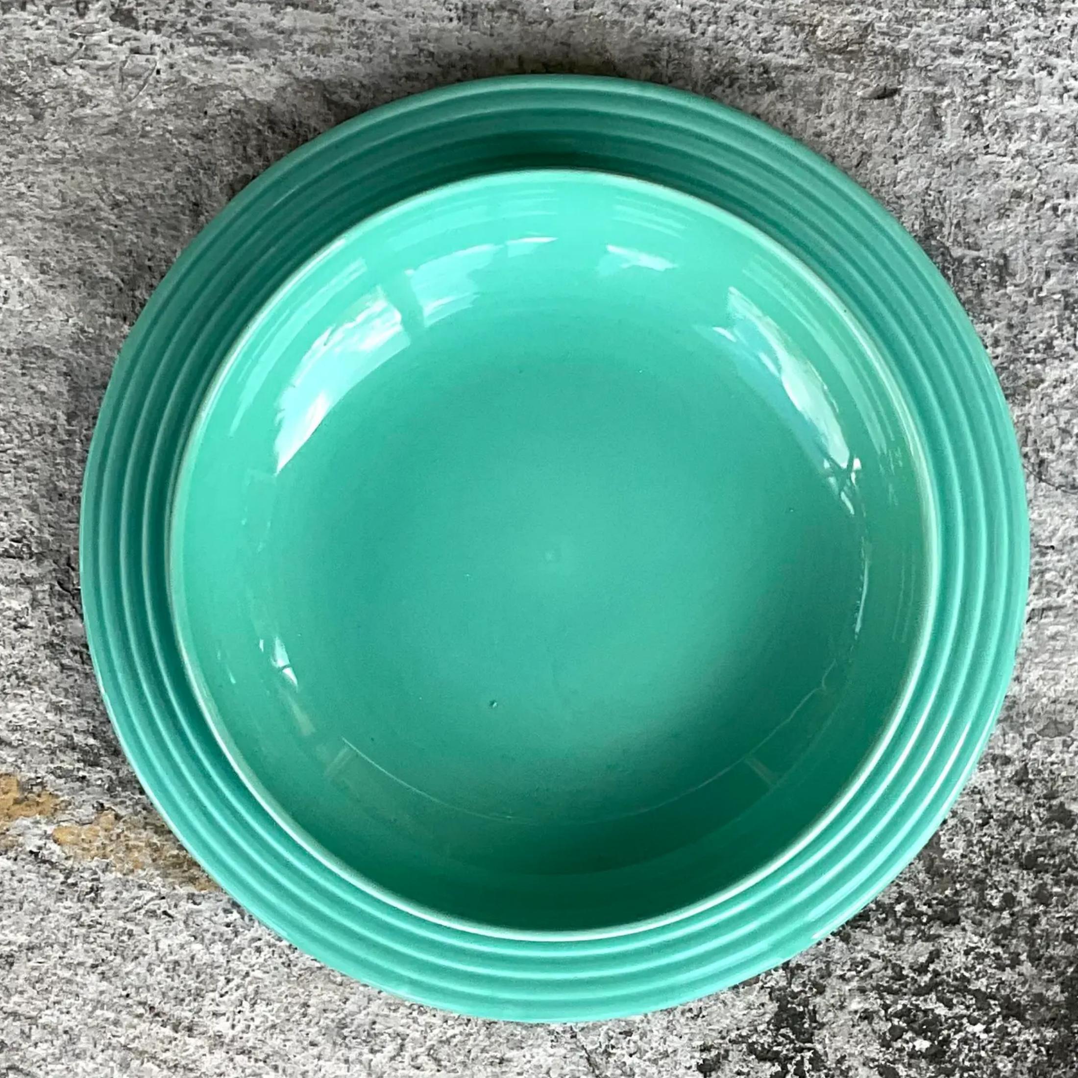 A fantastic set of glazed ceramic serving pieces. A large platter and matching serving bowl. A brilliant jade green with a ring design. Made in Portugal and stamped on the bottom. Acquired from a Palm Beach estate