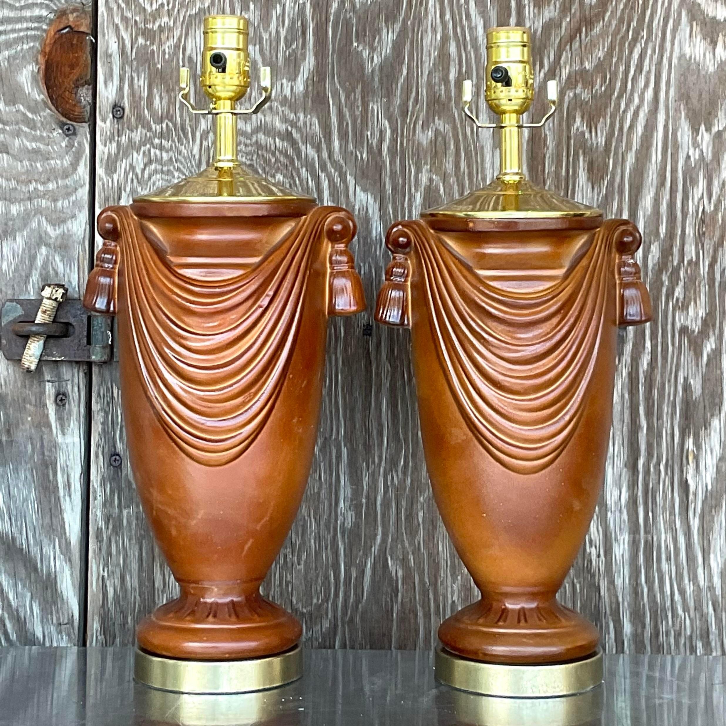 A fabulous pair of vintage Boho table lamps. A chic swag design in a gorgeous matte chocolate finish. Fully restored with all new wiring, hardware and brass plinths. Acquired from a Palm Beach estate.