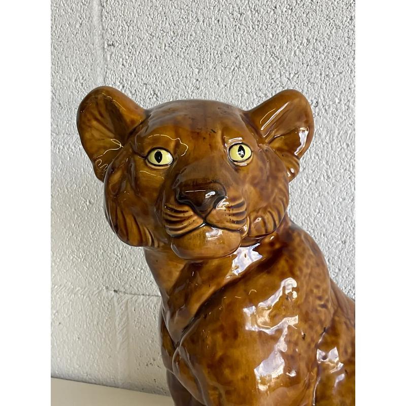 Fabulous vintage glazed ceramic tiger cub. Beautiful deep brown color. Signed by the artist and dated 1974. Acquired from a Palm Beach estate.