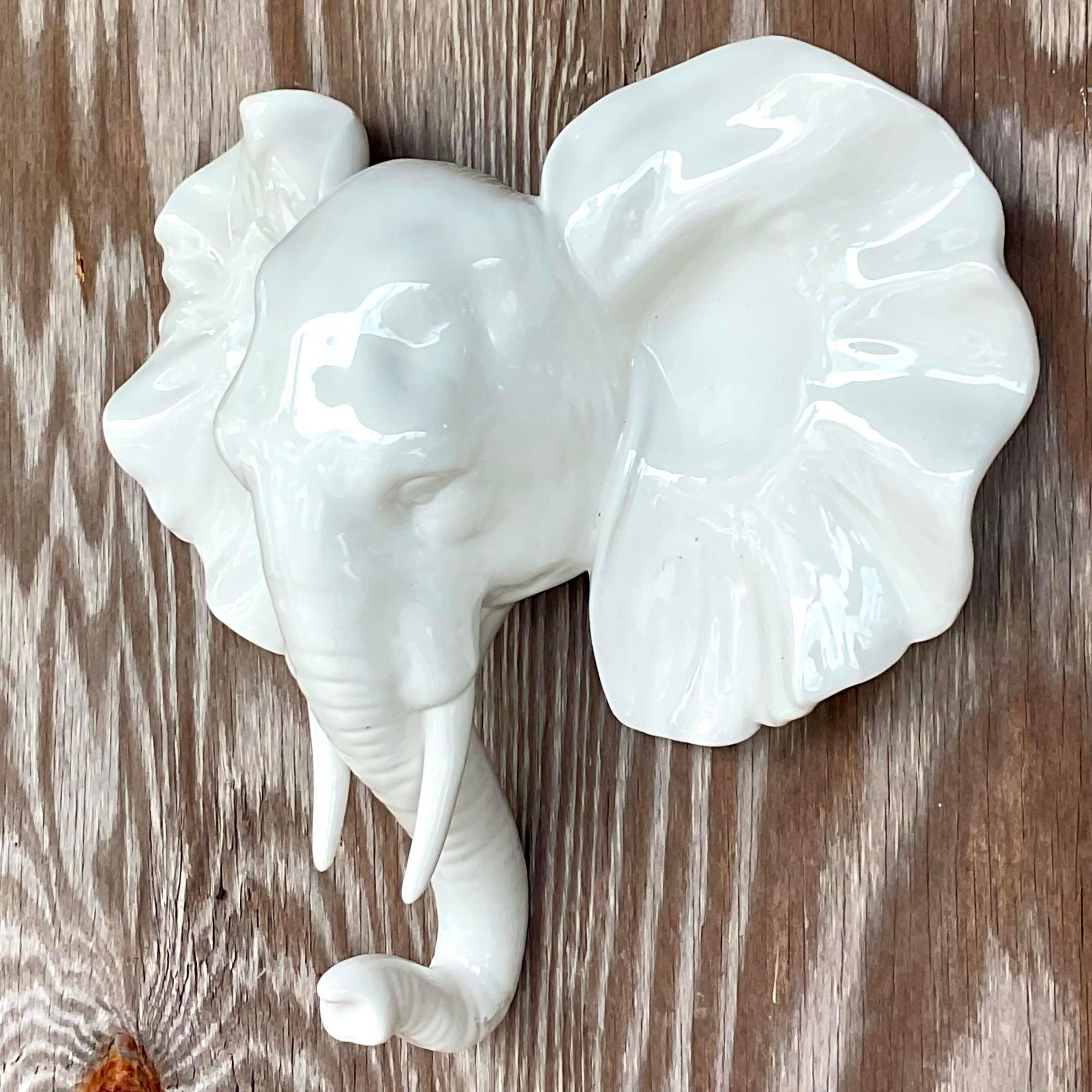 Fabulous vintage Boho wall sconce. Beautiful white glazed ceramic elephant. Acquired from a Palm Beach estate.