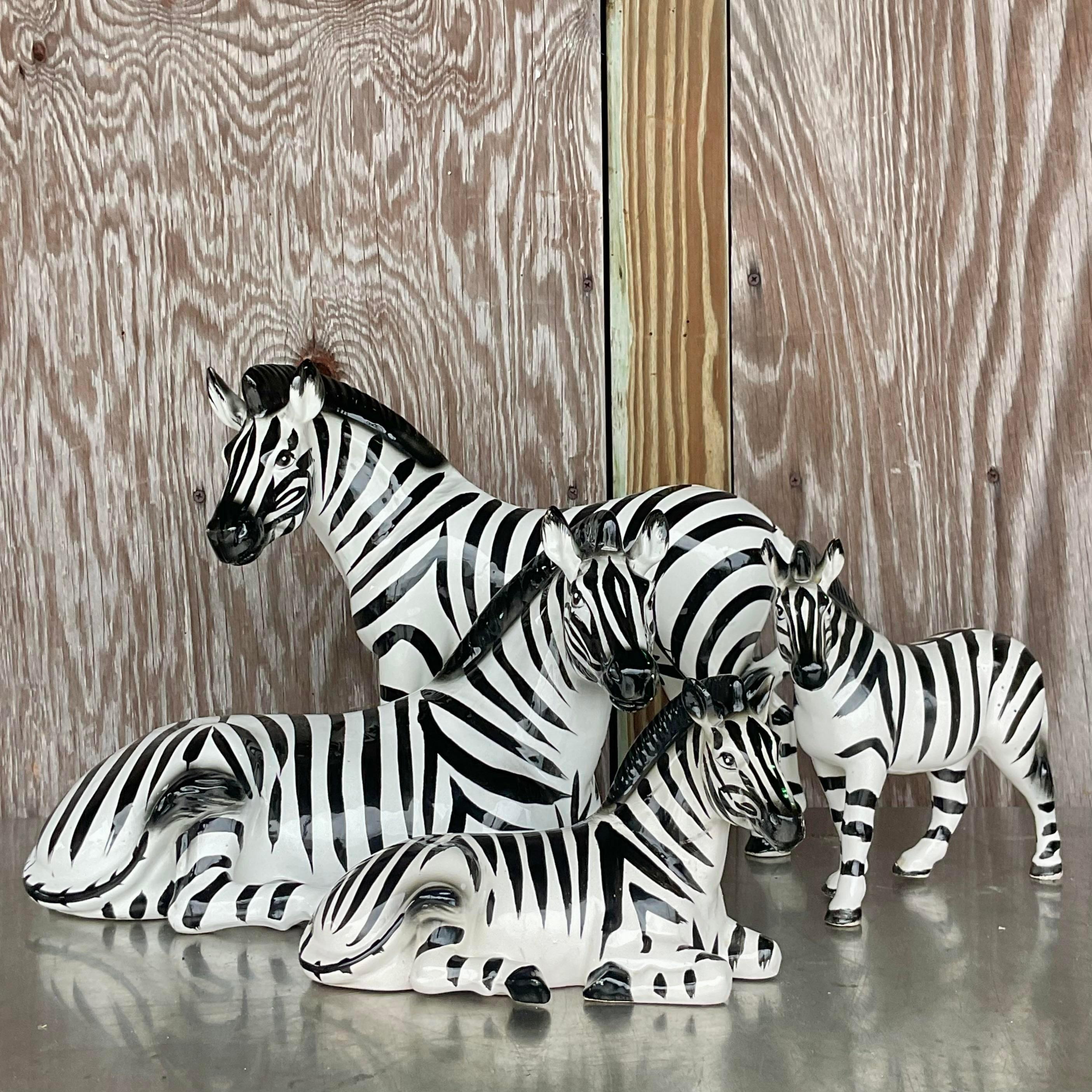 A fabulous set of four ceramic zebras. A chic little family in a hand painted glazed ceramic finish. Acquired from a Palm Beach estate.

Zebra 2 - 14x6.5x8.75
Zebra 3 - 9.25x3x8
Zebra 4 - 9x4x5.75
