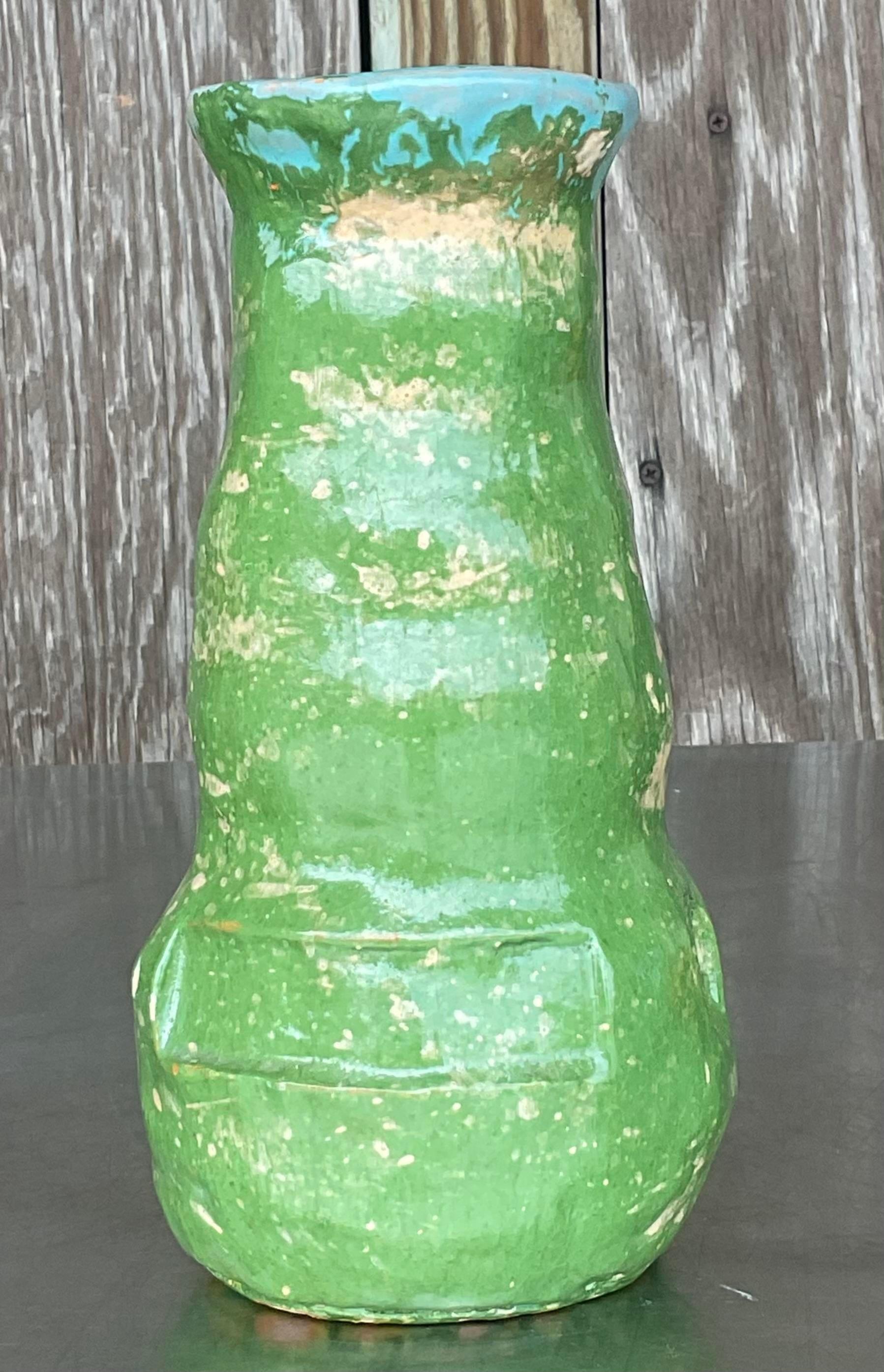 Add a touch of artistic flair to your decor with this Vintage Boho Glazed Studio Pottery Vase. Perfect for American-style interiors, this handcrafted piece features a rich, glazed finish and organic design, embodying the free-spirited essence of