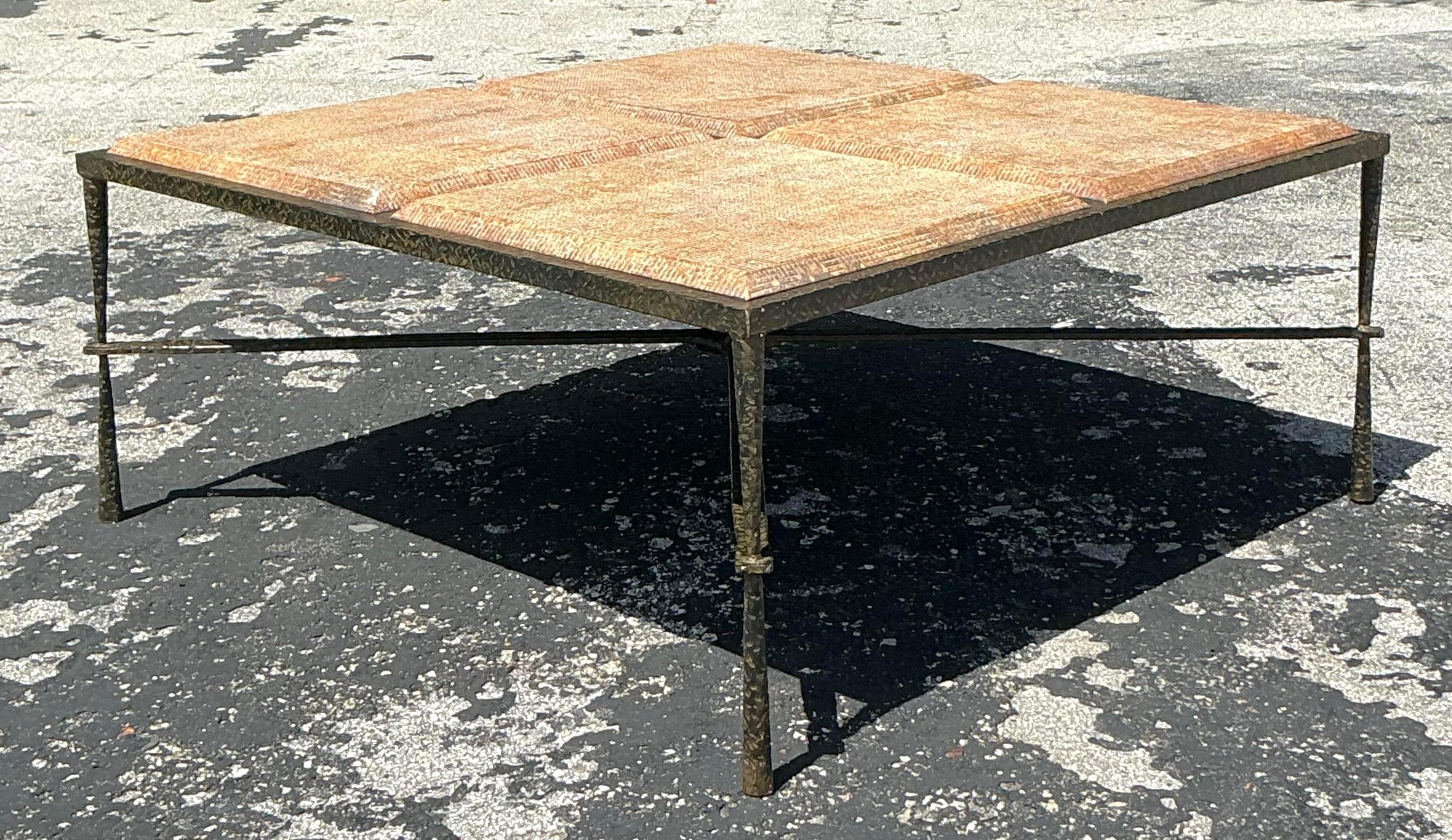 Unique vintage boho coffee table featuring a hammered metal frame and molded wood top. A striking blend of textures that brings eclectic style to any living space. Acquired from a Palm Beach estate. 