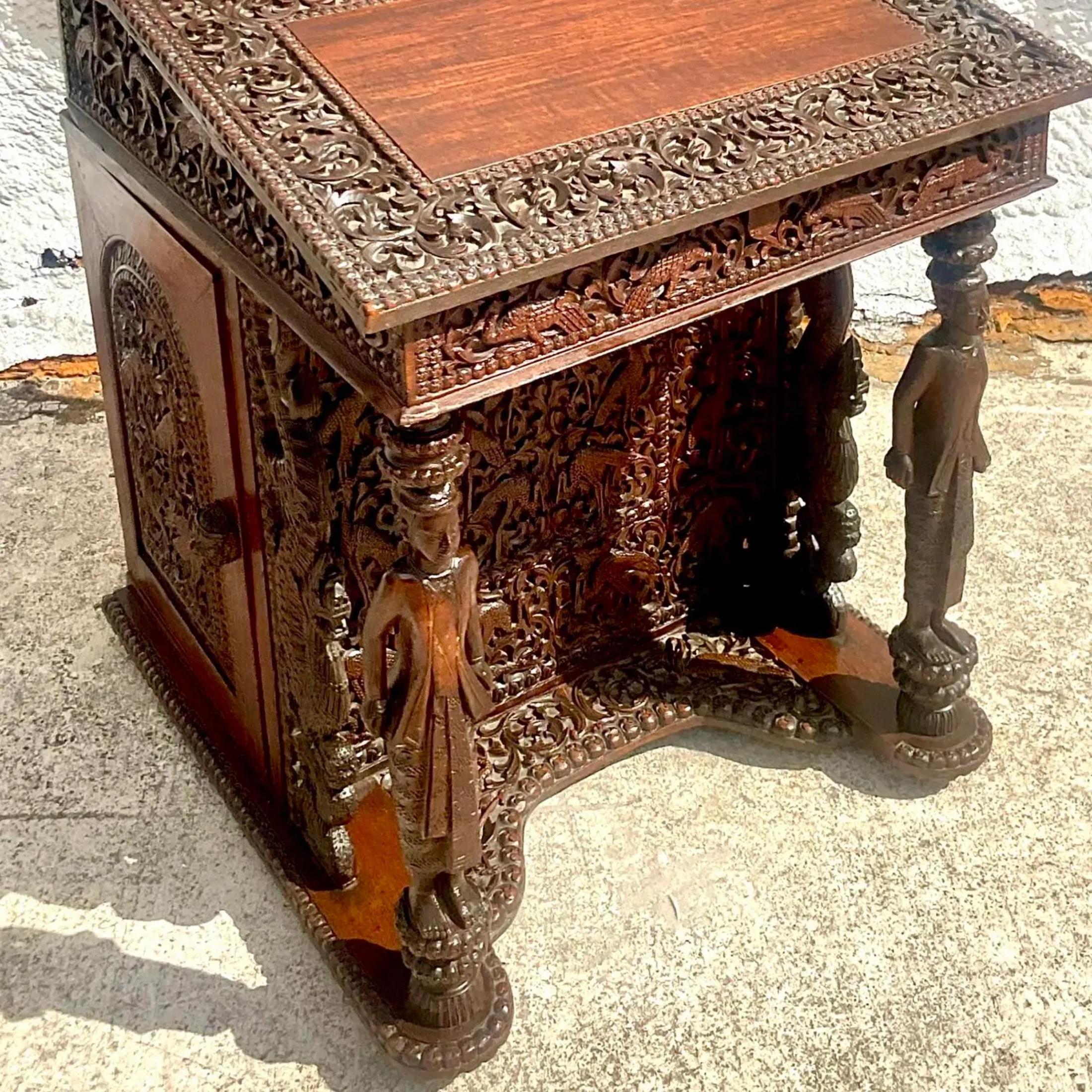 A vintage Boho hand carved desk. A beautiful Anglo Indian Davenport with incredible attention to detail. Lots of built in drawers and slots make this desk beautiful and functional. A real collectors item. Acquired from a Palm Beach estate