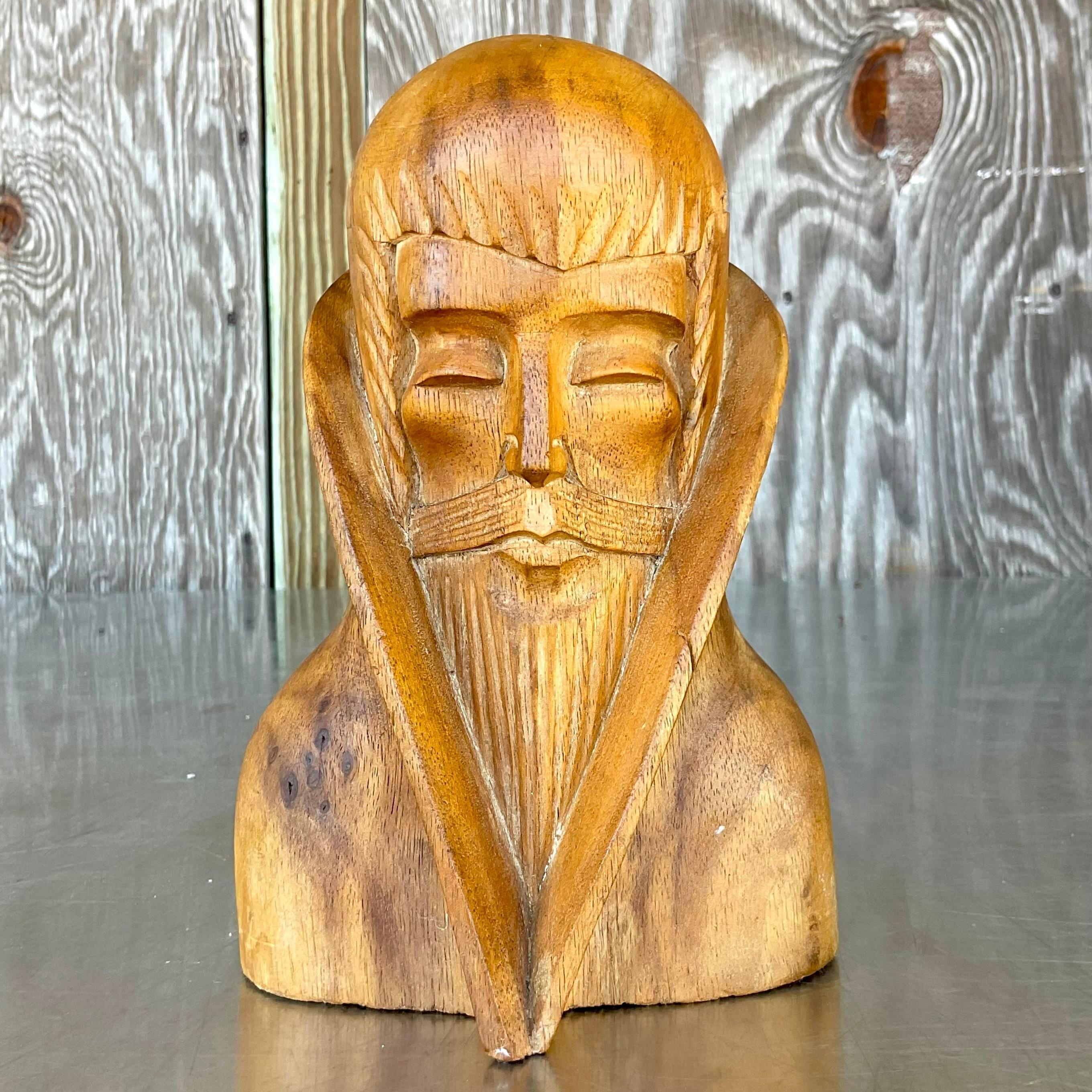 Capture attention with our Vintage Boho Hand Carved Bust of a Man. This American-style piece showcases intricate craftsmanship and bohemian allure, making it a distinctive and artful addition to any eclectic or traditional décor