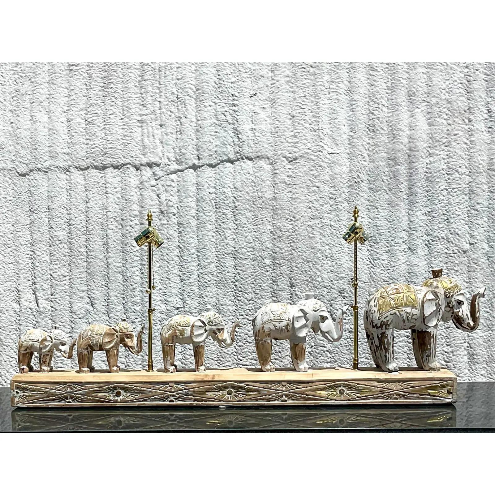 Fantastic vintage Coastal long lamp. Beautiful hand carved cerused wood with a chic parade of elephants. Each elephant has a touch of a gilt flash. Perfect for a long credenza or entry console. Imagine with some vintage printed shades or vintage