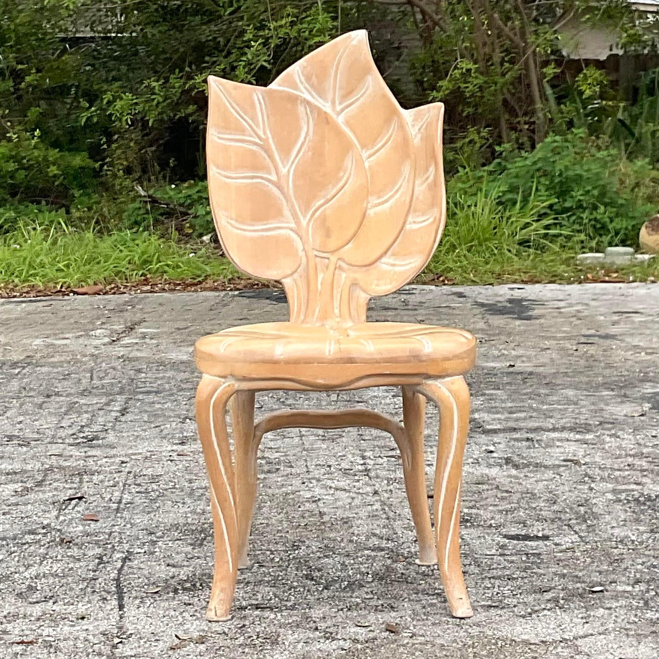A fantastic vintage Boho hand carved leaf chair. Done in the manner of Bartolozzi and Maioli. Beautiful attention to detail and a light washed finish. Acquired from a Palm Beach estate.