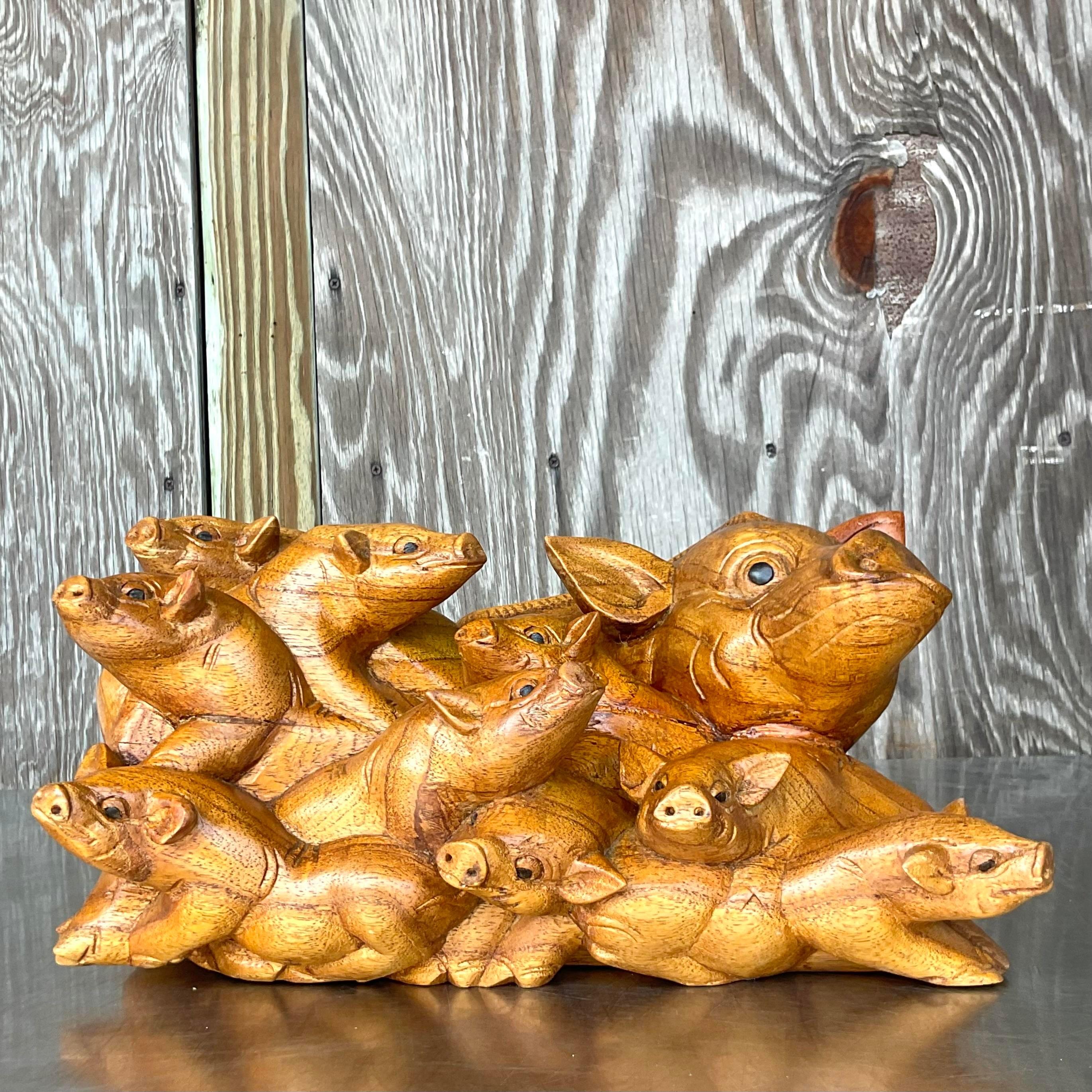 Capture the rustic charm of Americana with our Vintage Boho Hand Carved Pig Family. Each piece meticulously crafted, these whimsical carvings celebrate the warmth of family and the artistry of handwork. Perfect for adding a touch of playful