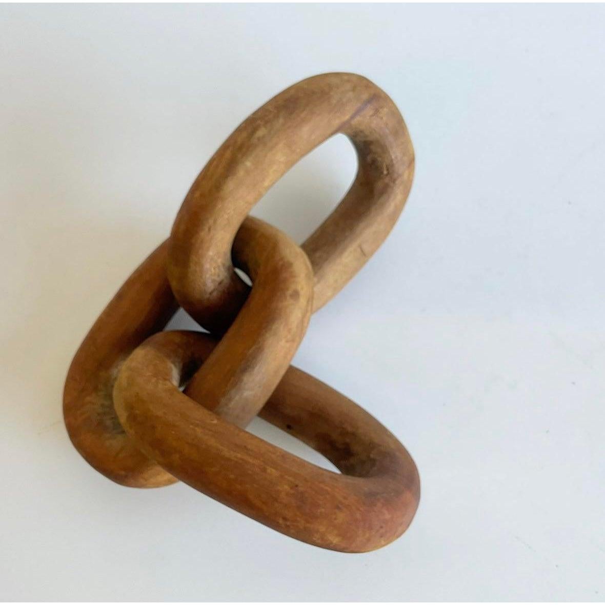 Incredible vintage Boho chic wooden sculpture. Carved from a single piece of wood. Three separate rings that are connected. A really special piece. Acquired from a Palm Beach estate.