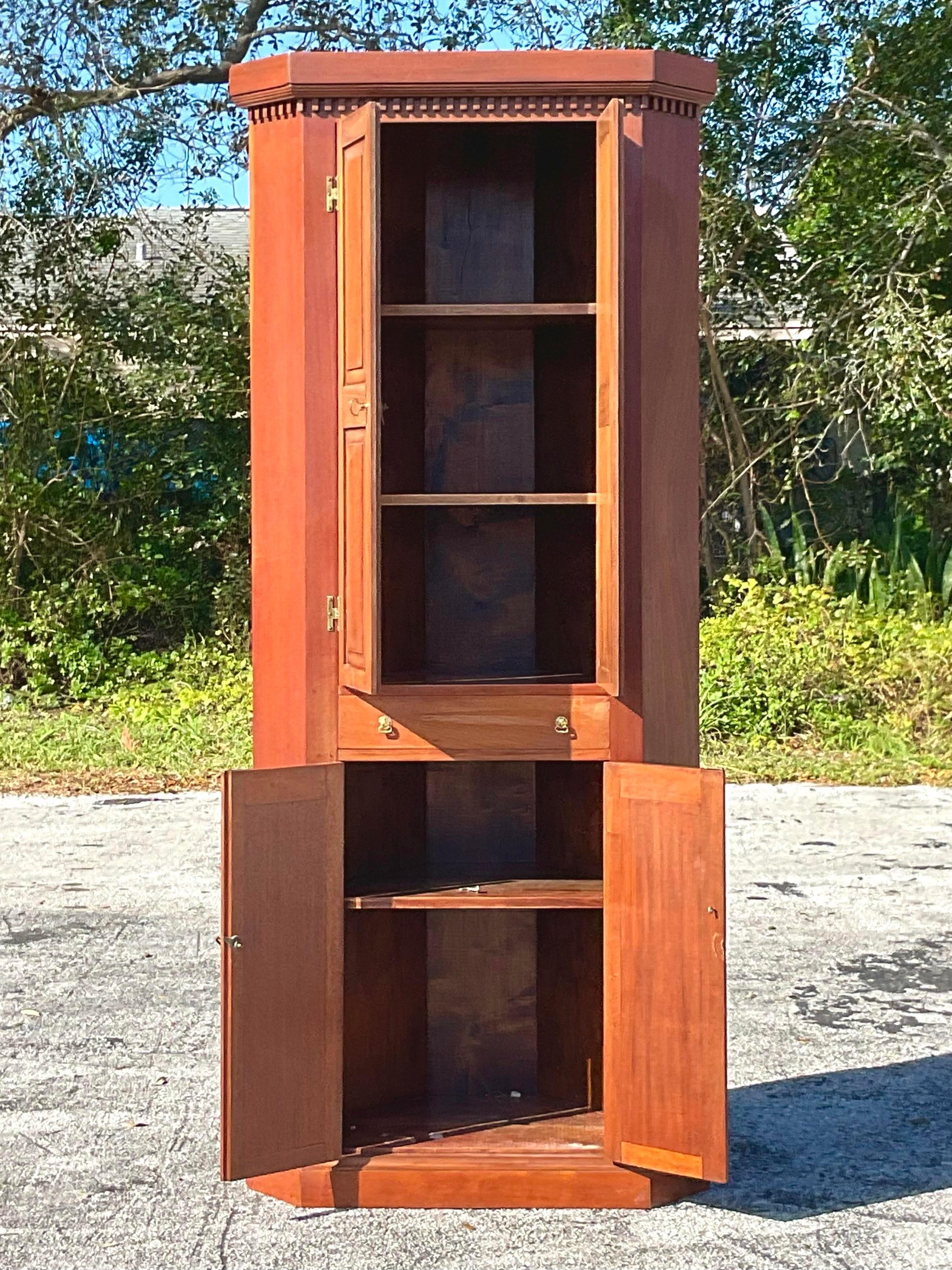 An incredible vintage Boho corner cabinet. Hand made in 1937 and signed on the back. Lots of great storage with doors that close to conceal your treasures. Acquired from a Miami estate. 