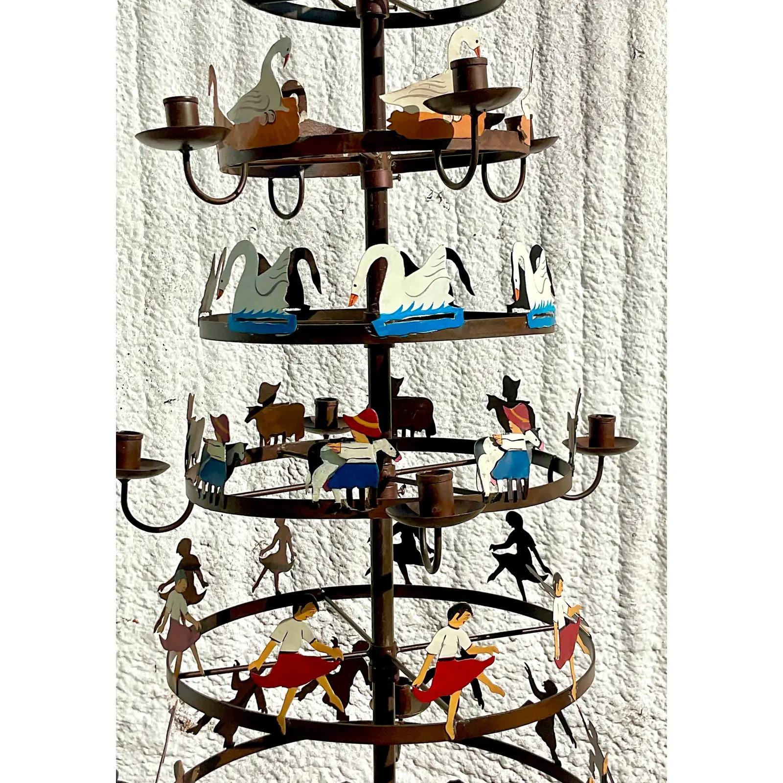A spectacular vintage Boho wrought iron Christmas tree. A beautiful hand painted composition where each row depicts a different line from the iconic story book. Candle holders adorn each row. Perfect as is or add Pine tree or Magnolia branches for