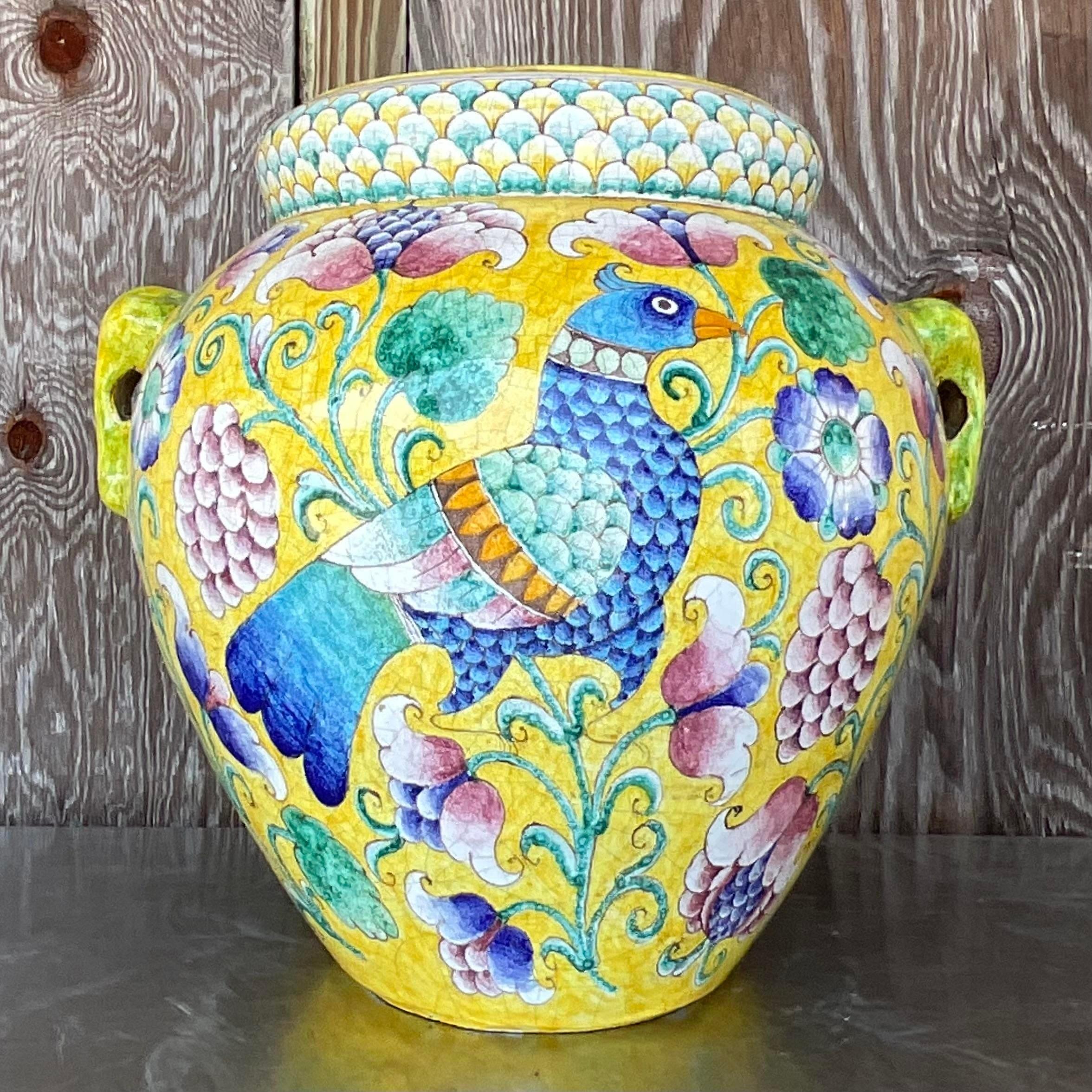 Infuse your space with old-world charm using this Vintage Boho Hand-Painted Italian Urn. With its artisanal flair and timeless design, this piece adds a touch of European elegance to your American decor, creating a captivating focal point that