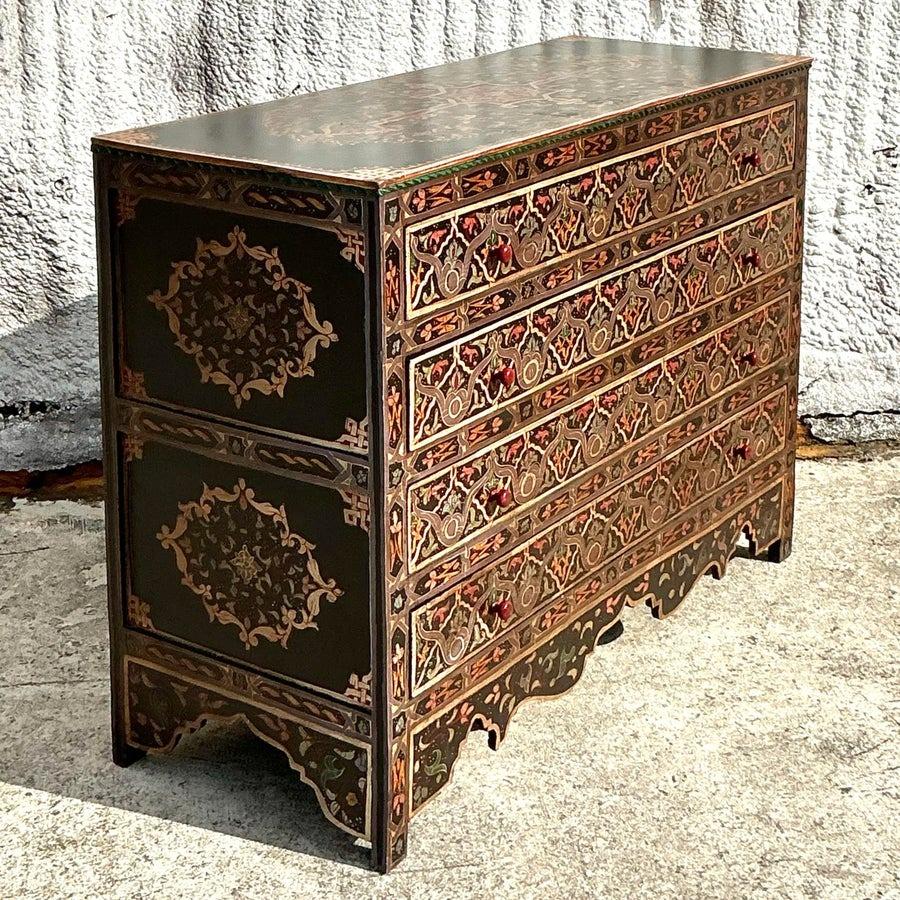This stunning piece showcases intricate hand-painted designs inspired by traditional Moroccan artistry, blending bold colors and geometric patterns that exude global appeal. The distressed finish adds a touch of vintage authenticity, making it a
