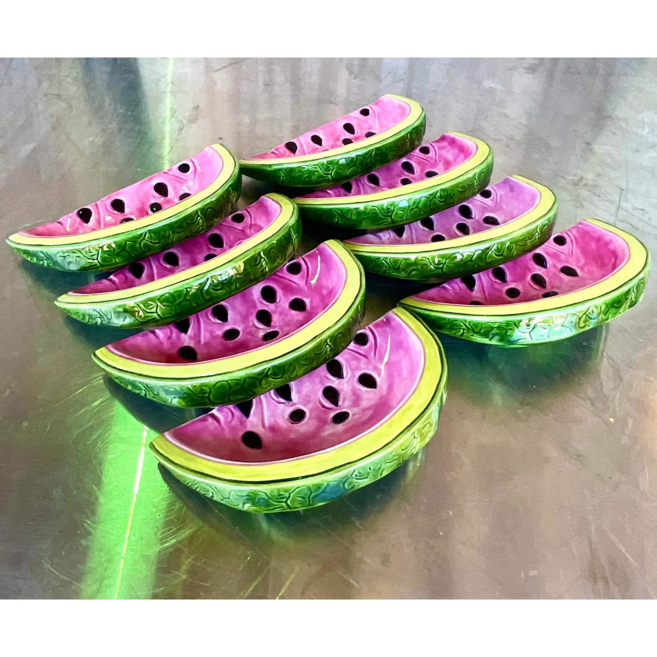Fantastic set of 8 hand painted luncheon plates. A charming watermelon slice perfect for your summer get together. Brilliant colors with a glazed ceramic finish. Signed on the bottom. Acquired from a Palm Beach estate