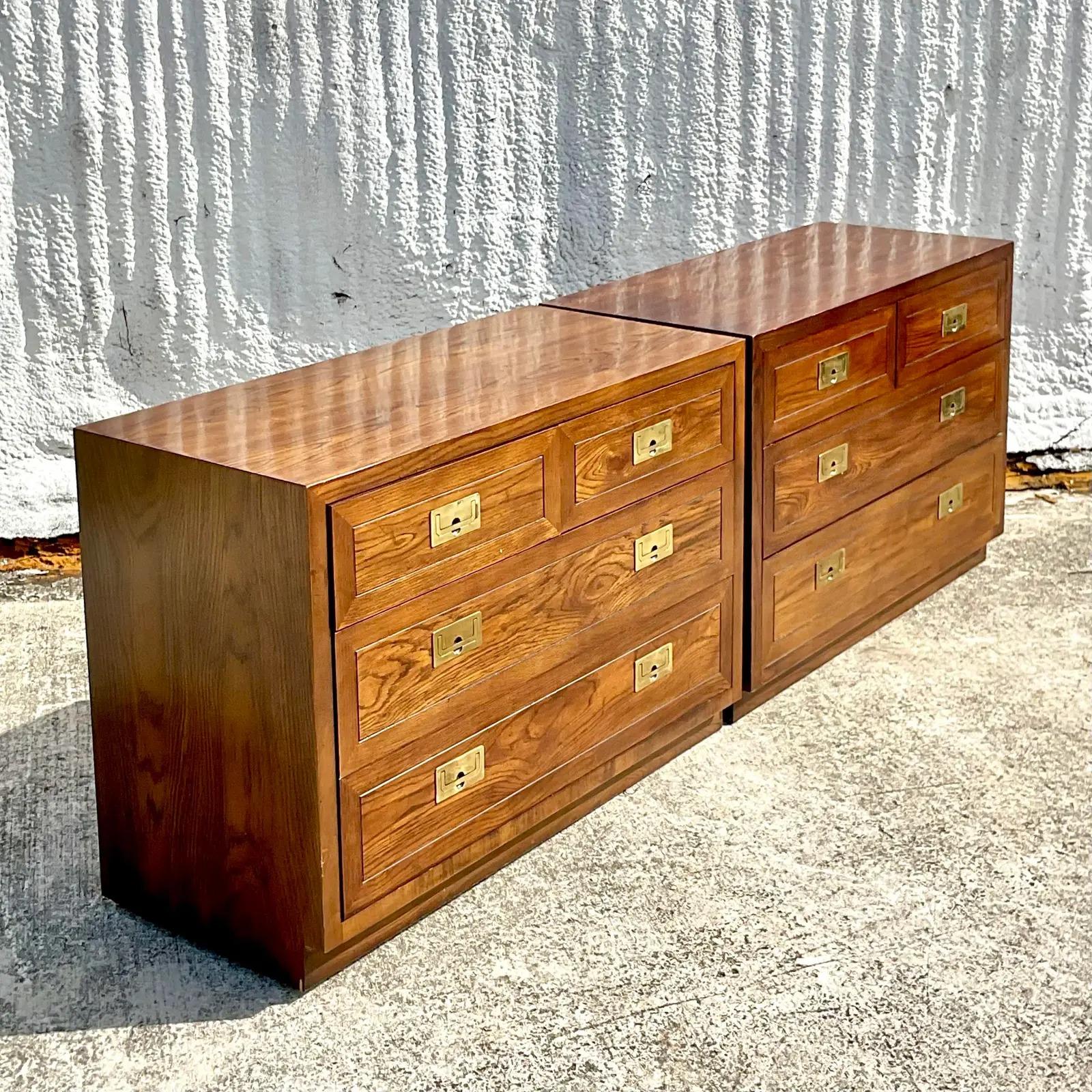 A fabulous Boho Pair of vintage Campaign nightstands. Made by the iconic Henredon group. Beautiful wood grain detail and brass hardware. Acquired from a Palm Beach estate.