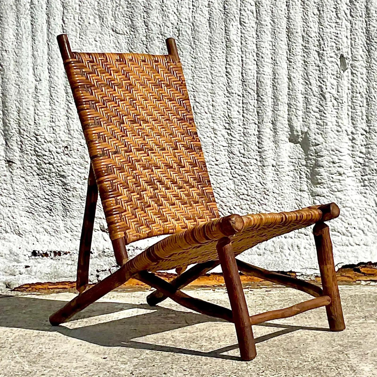 A striking vintage Coastal side chair. Heavy Hickory branch frame with wrapped rattan woven panels. Beautiful and functional. Acquired from a Palm Beach estate.