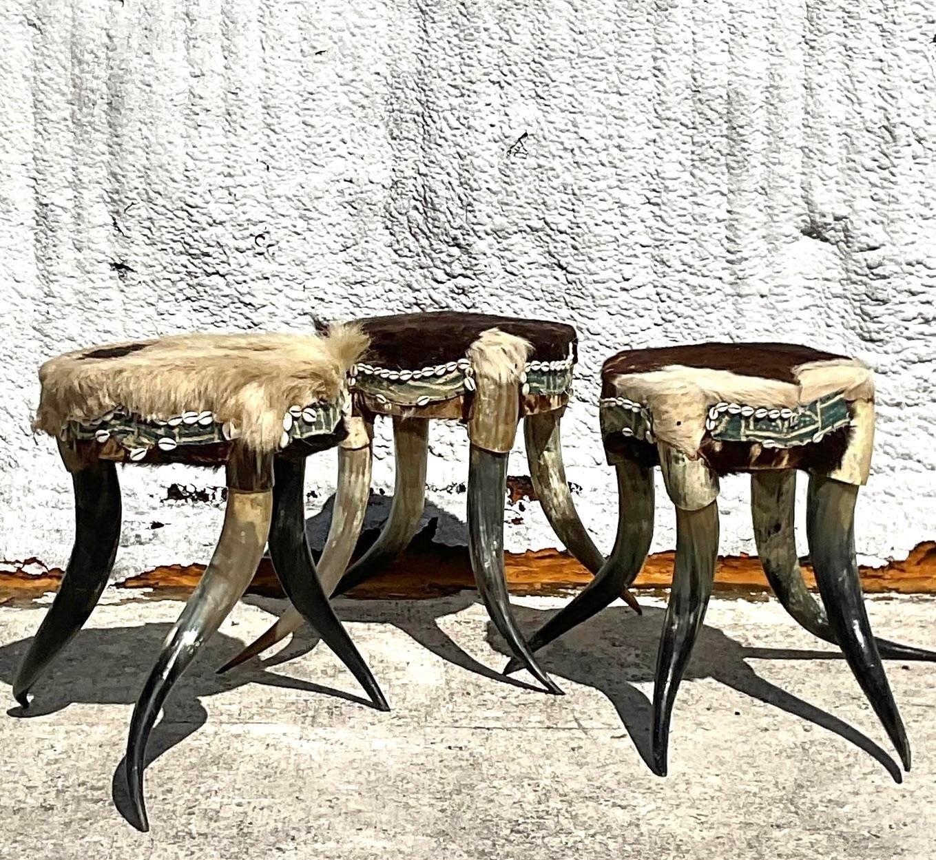 Infuse your space with a touch of American flair with this set of Vintage Boho Horn Stools. Crafted with authentic materials and eclectic design, these stools effortlessly blend rustic charm with bohemian sophistication. Perfect for adding character