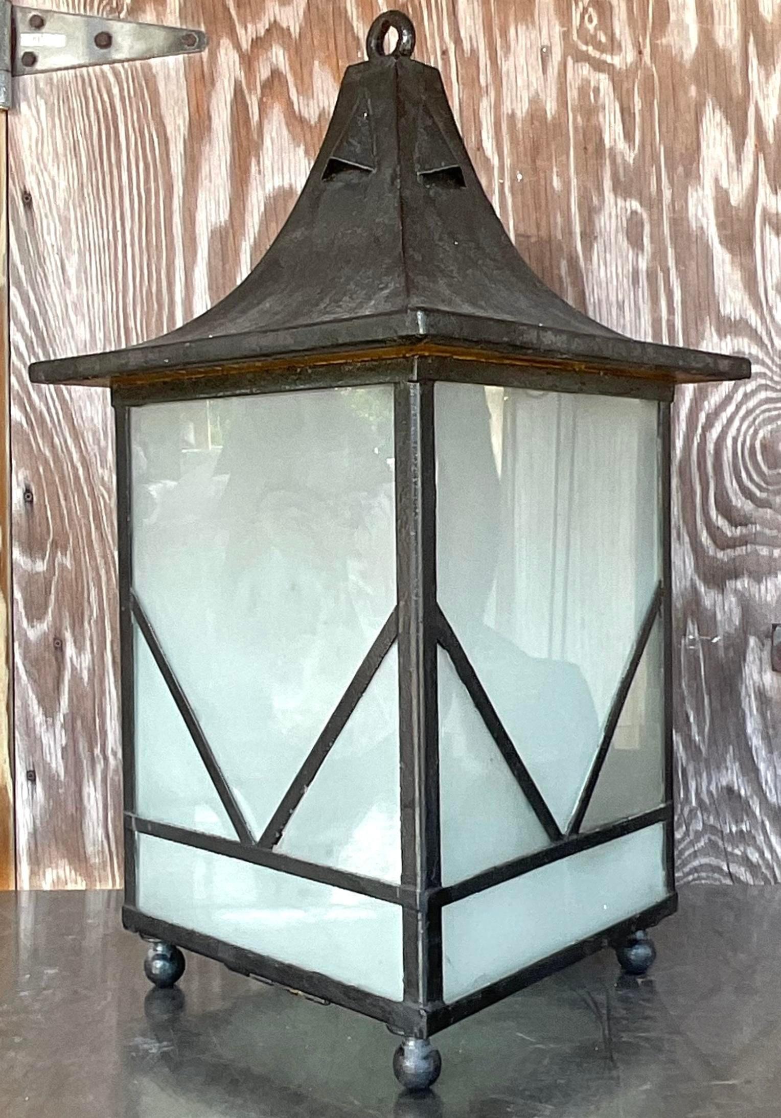 Iconic Illumination: The Vintage Boho Monumental Iron Lantern captures the essence of American style with its grandeur and timeless appeal. Crafted with precision and artistry, this iron masterpiece adds a touch of vintage charm to any space,
