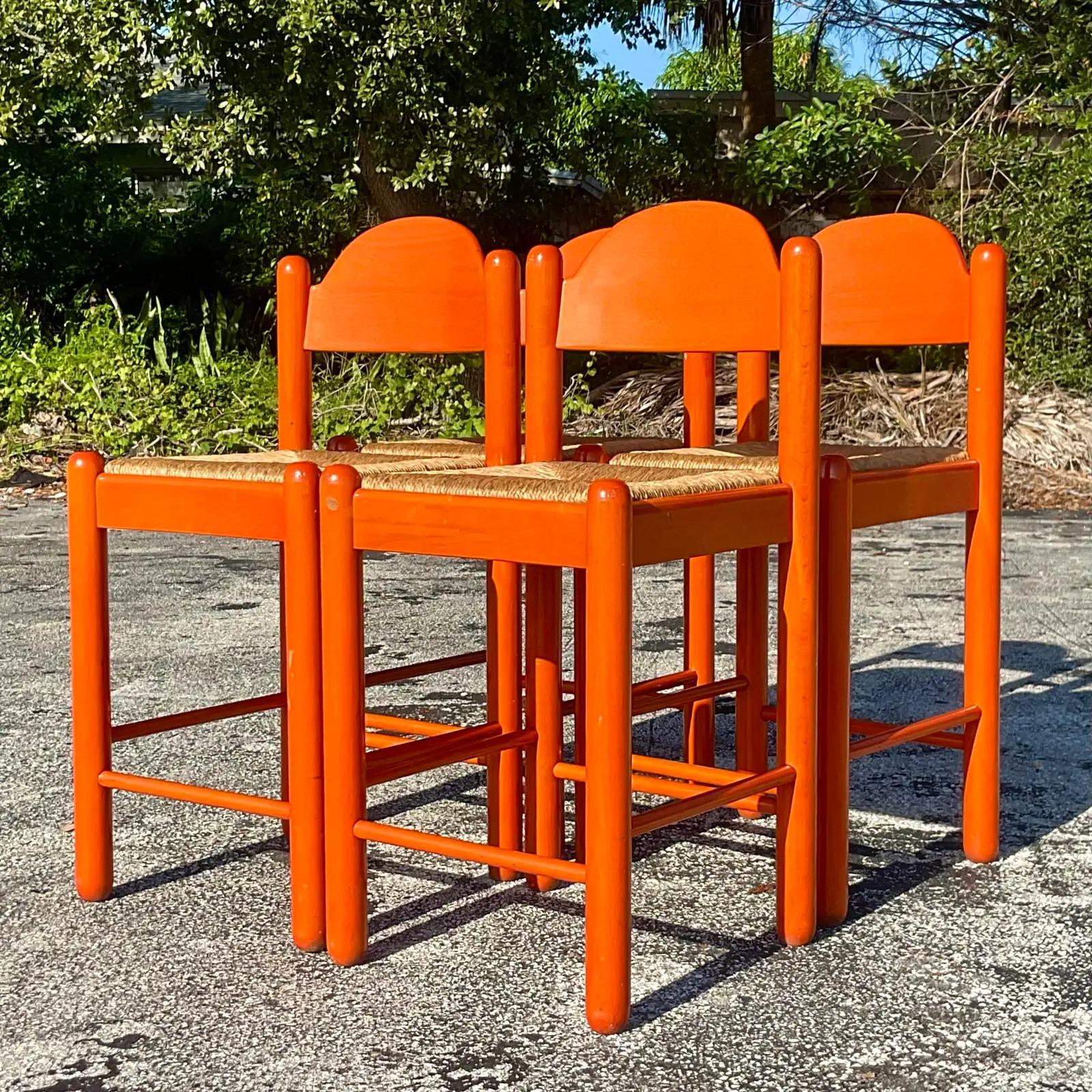 A fabulous set of vintage Boho bar stools. A beautiful Hermes orange with chic Rush seats. Made in Italy and marked on the bottom of one stool. Acquired from a Palm Beach estate.

The stools are in good vintage condition. Scuffs and blemishes