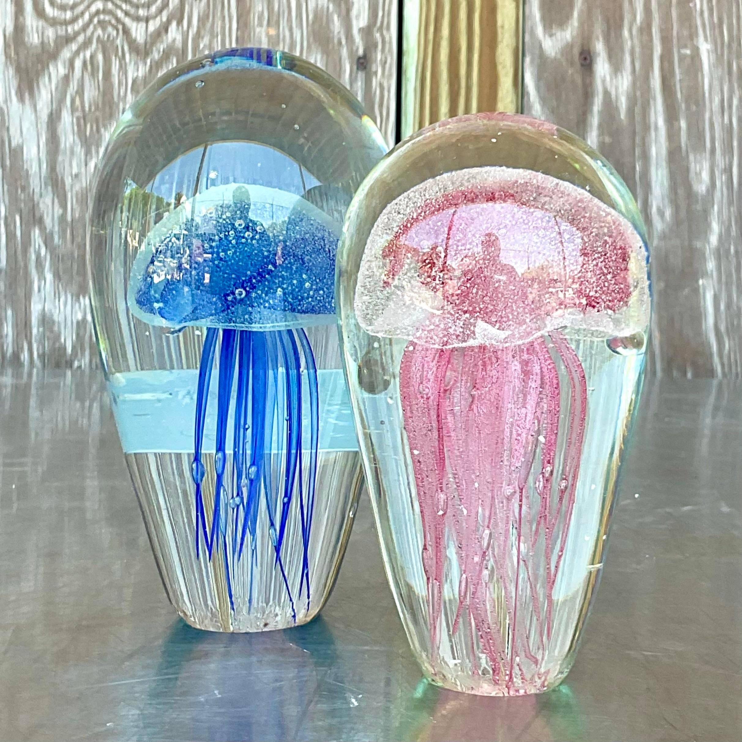 Transatlantic Wonder: The Vintage Boho Italian Glass Jellyfish, reminiscent of Murano's artisanal tradition, merges Italian craftsmanship with American creativity. This set of two ethereal pieces embodies the spirit of coastal charm and artistic