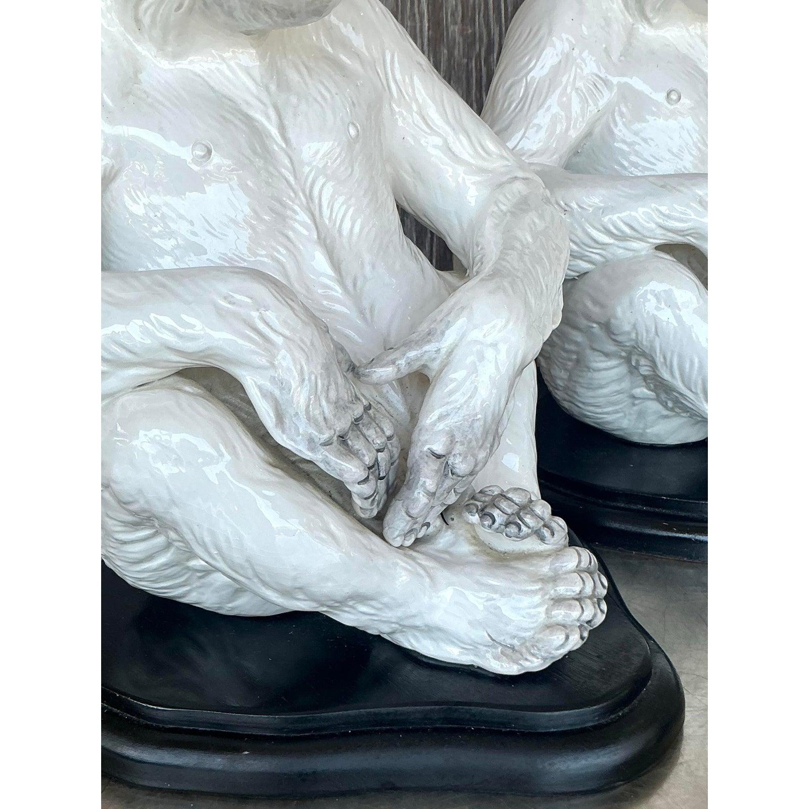 Unleash a touch of worldly glamour and playful sophistication with this exceptional pair of vintage Italian ceramic monkey lamps. Each lamp is a masterful work of sculpture, featuring a serene and contemplative monkey figure rendered in exquisite