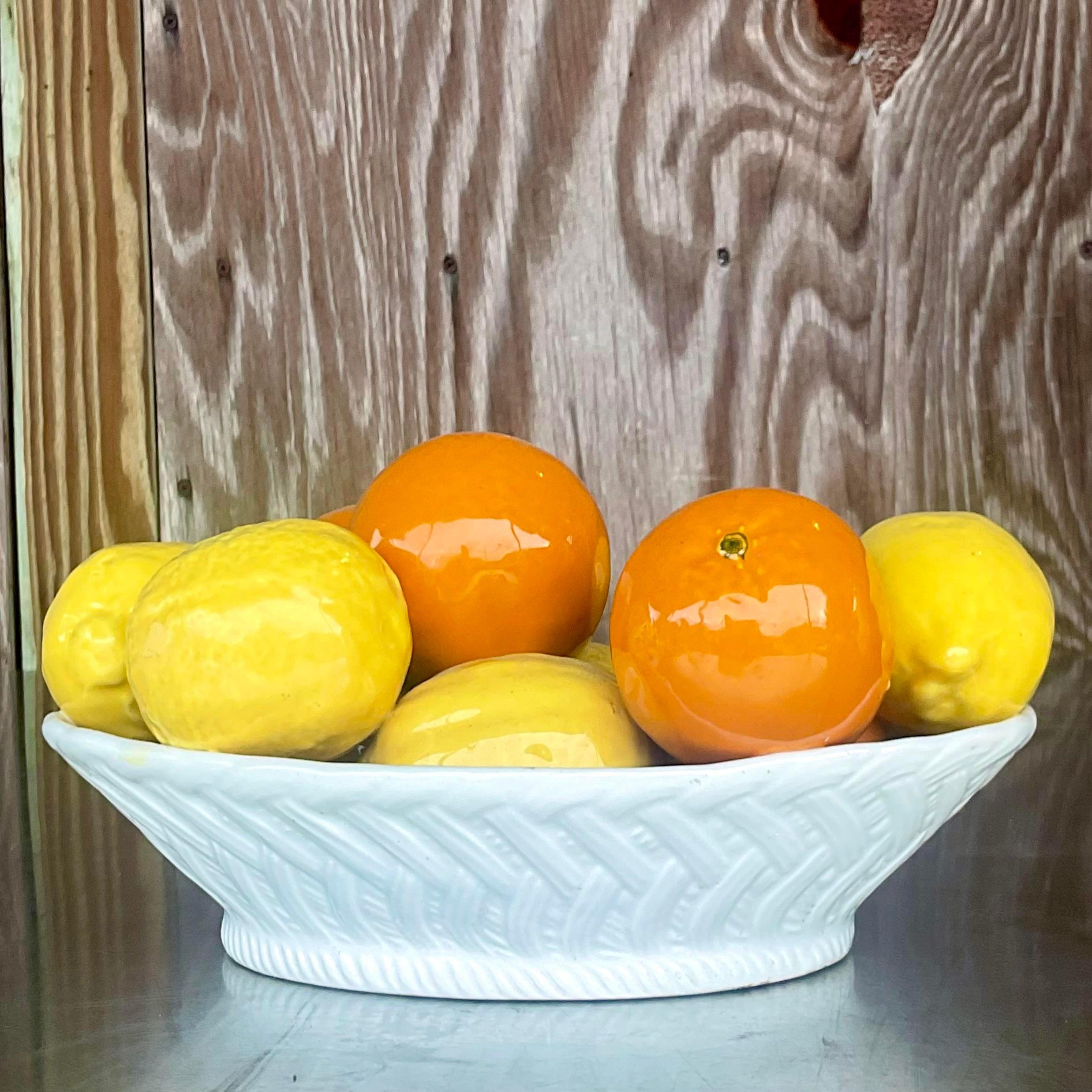 A fabulous vintage Boho bowl of fruit. A beautifully colored bowl of oranges and lemons. Made in Italy and marked on the bottom. Acquired from a Palm Beach estate.