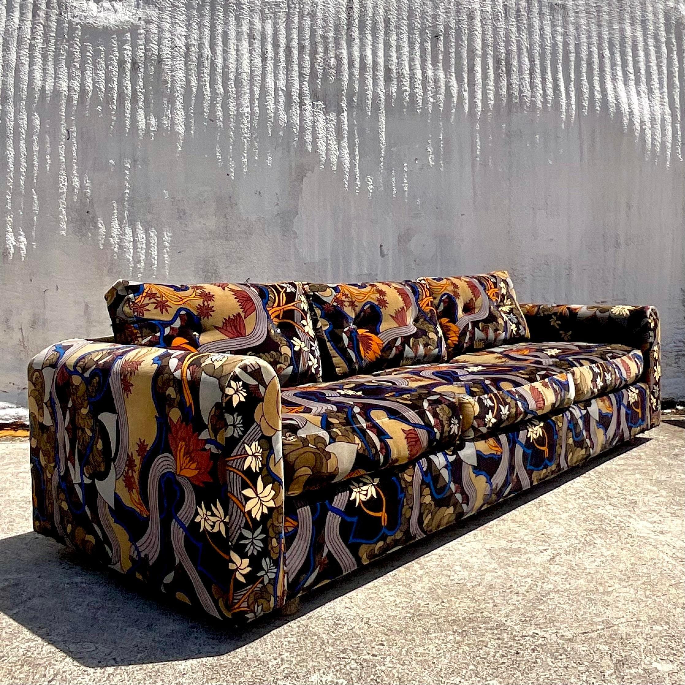 Indulge in the timeless allure of American vintage boho with this Jack Lenor Larsen mod print velvet sofa. Featuring iconic mid-century design and luxurious velvet upholstery, this sofa seamlessly blends comfort and style. Elevate your living space