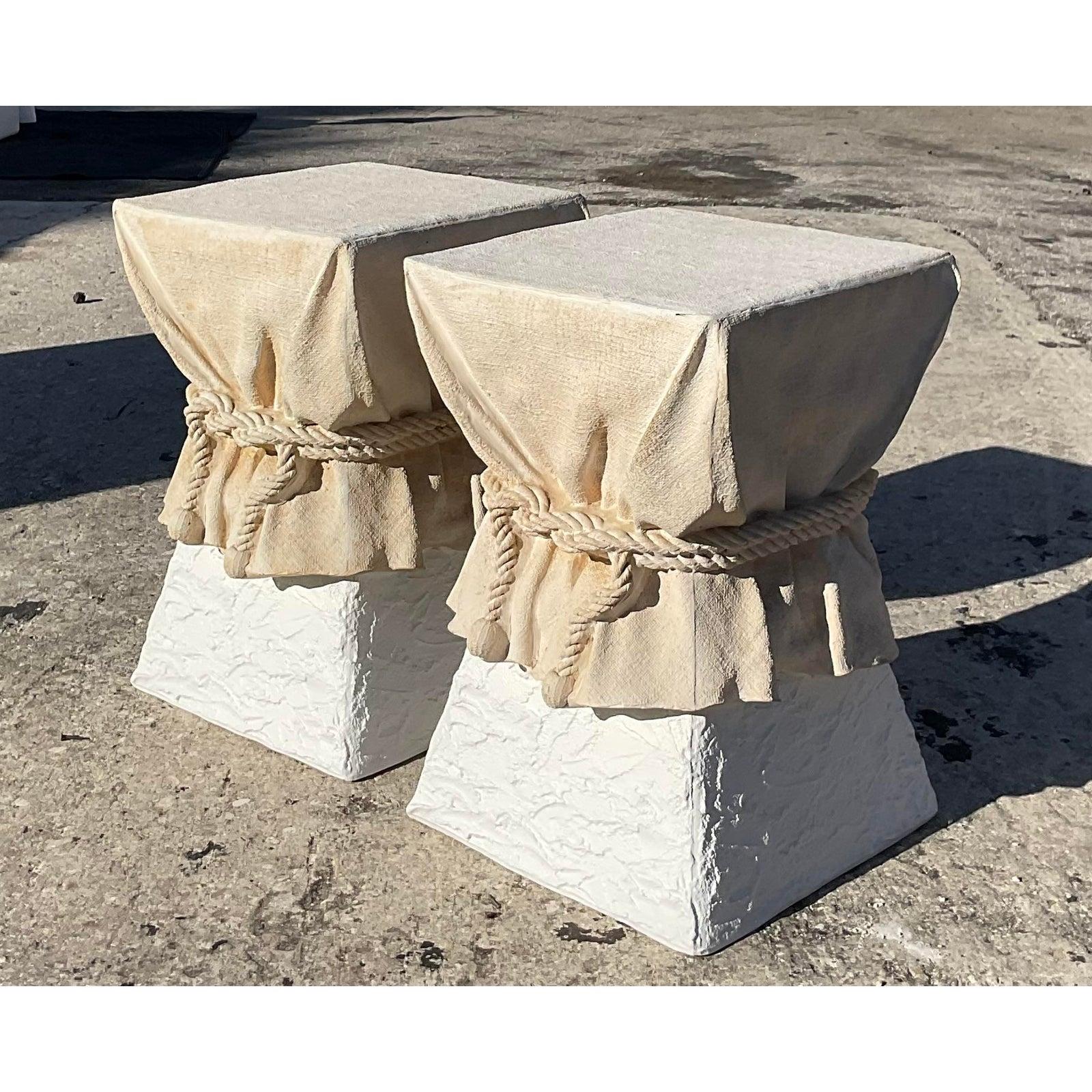 Fantastic pair of vintage John Dickinson side tables. Iconic draped plaster design with a rope tie. Two tone finish to feature the drape look. Acquired from a Palm Beach estate.