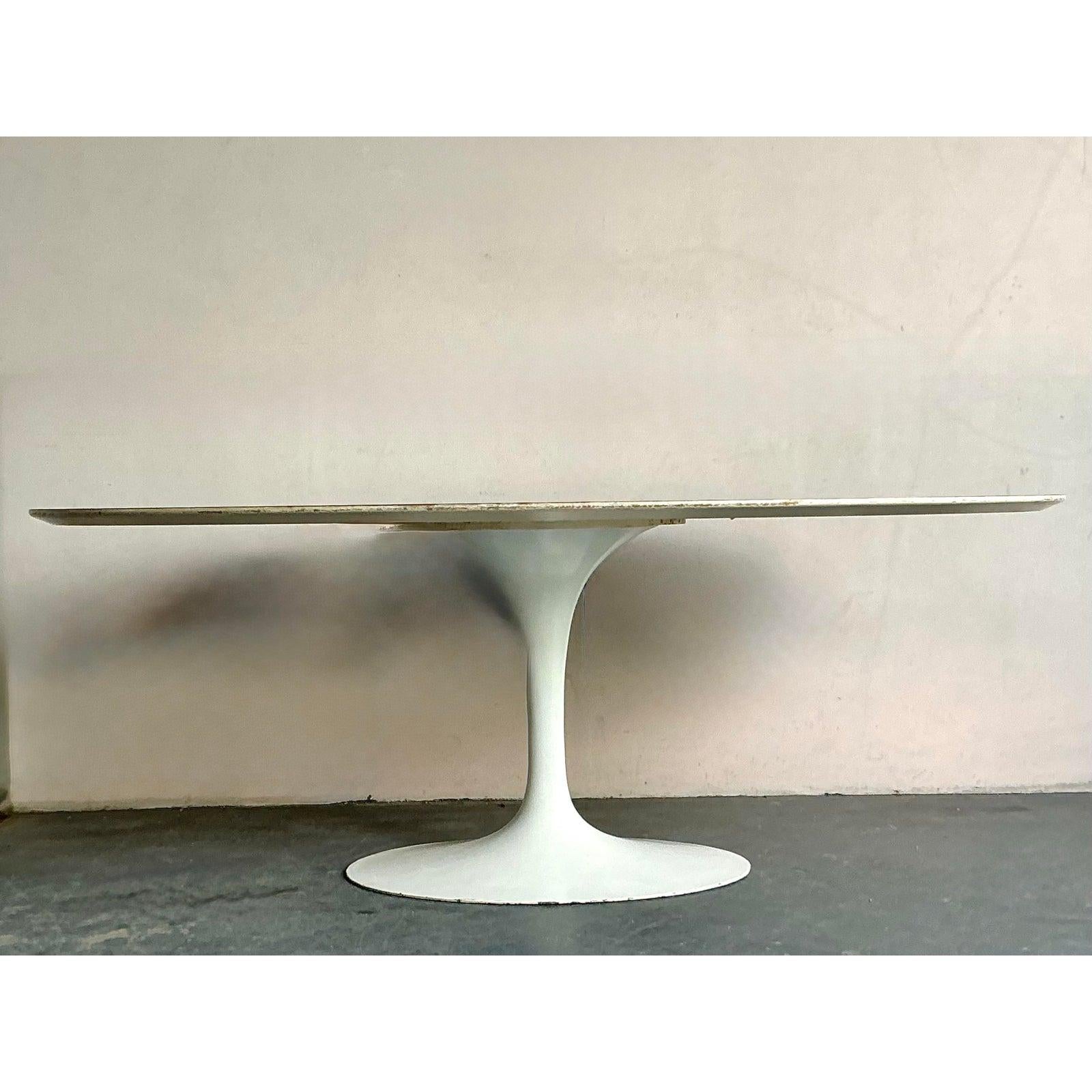 This expansive oval table top is defined by its clean lines and monumental scale, embodying the timeless grace of minimalist modern design often associated with architects like Eero Saarinen. The piece features a smooth, matte white lacquered