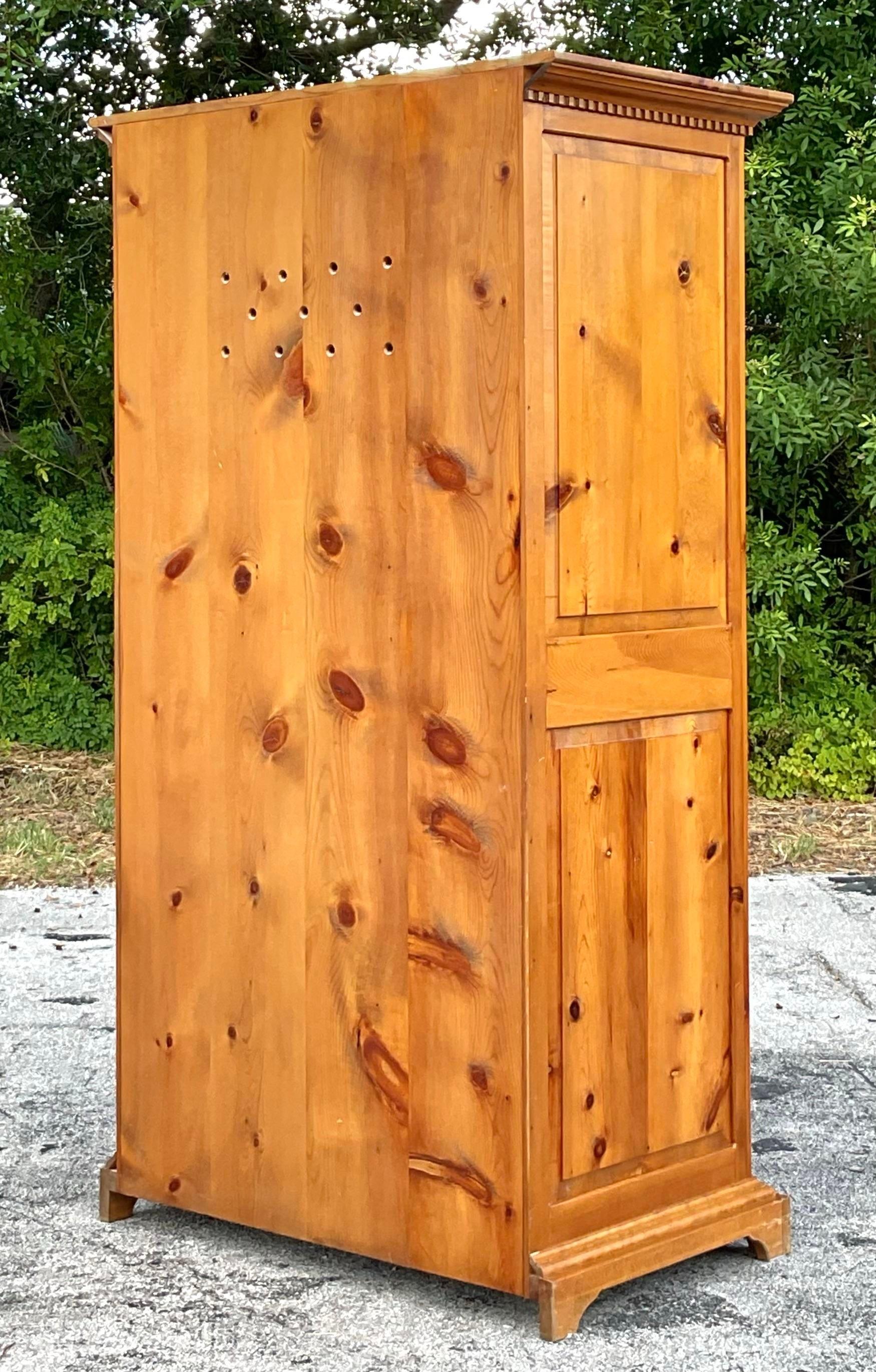Add rustic charm to your home with this Vintage Boho Knotty Alpine Entertainment Armoire. Featuring rich, textured wood and a spacious interior, it’s perfect for organizing your media essentials while enhancing your living space with its unique,
