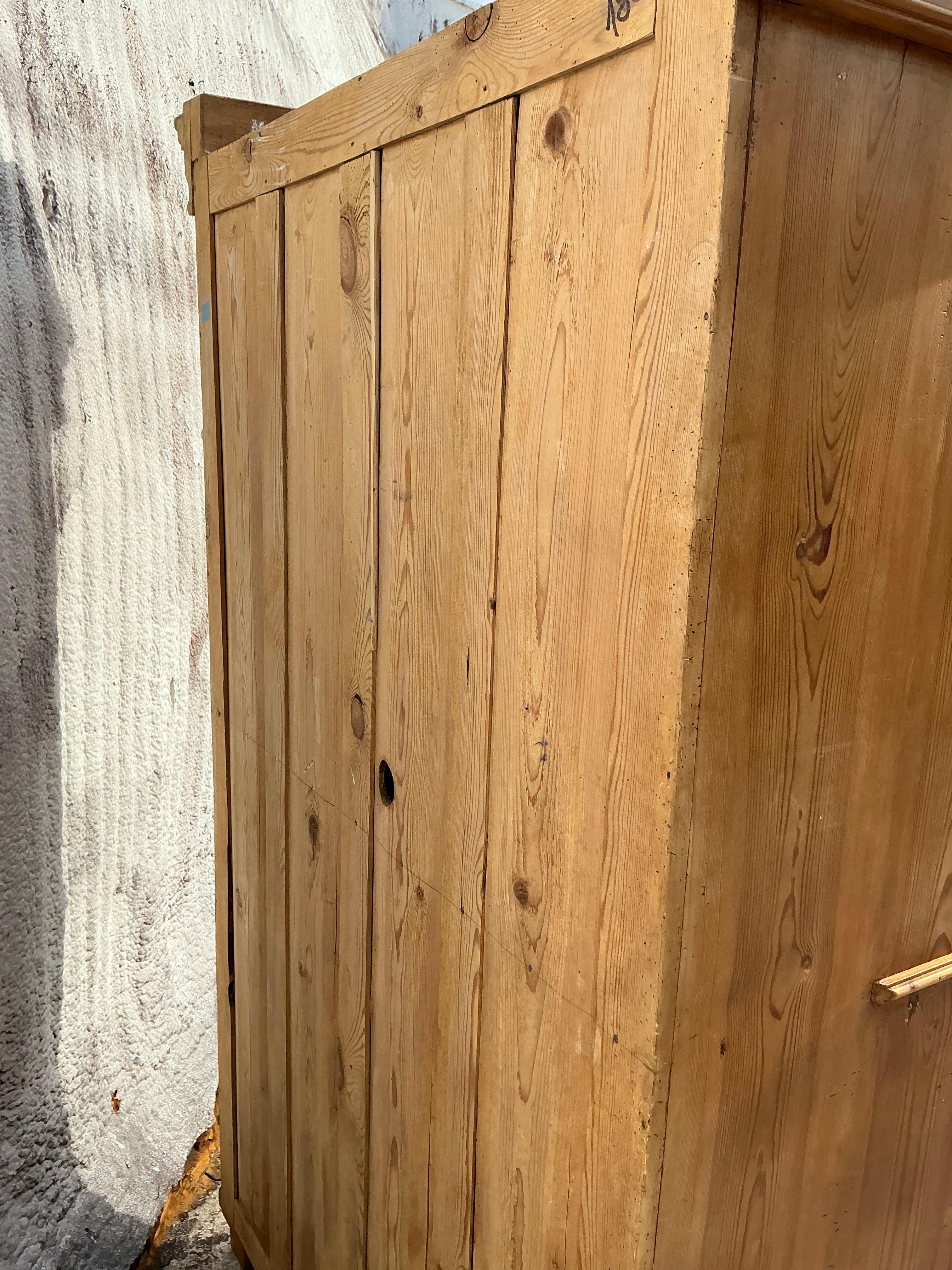 This vintage boho armoire, crafted from knotty pine, exudes rustic charm with a free-spirited touch. Its natural wood grain and unique knots add warmth and character, while spacious storage makes it both stylish and functional. Perfect for adding a