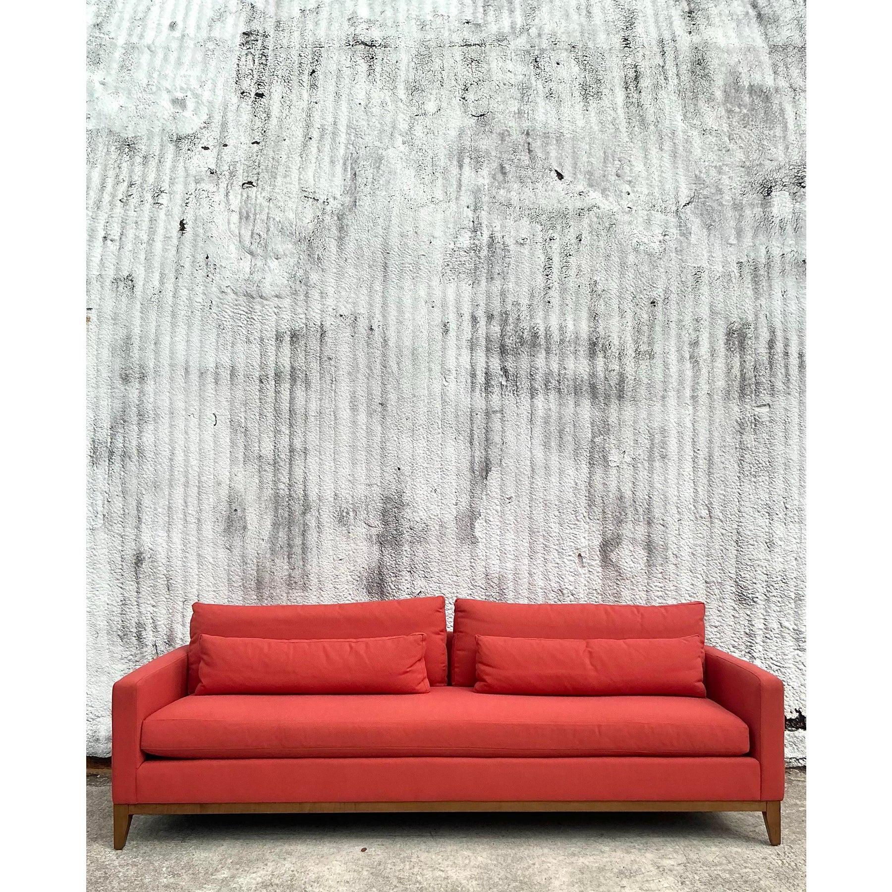 This exquisite vintage Kravet Tuxedo sofa is a statement of elegance and comfort, featuring luxurious Perennials performance fabric in a rich coral hue. The clean-lined tuxedo silhouette offers a modern yet timeless aesthetic, while the plush