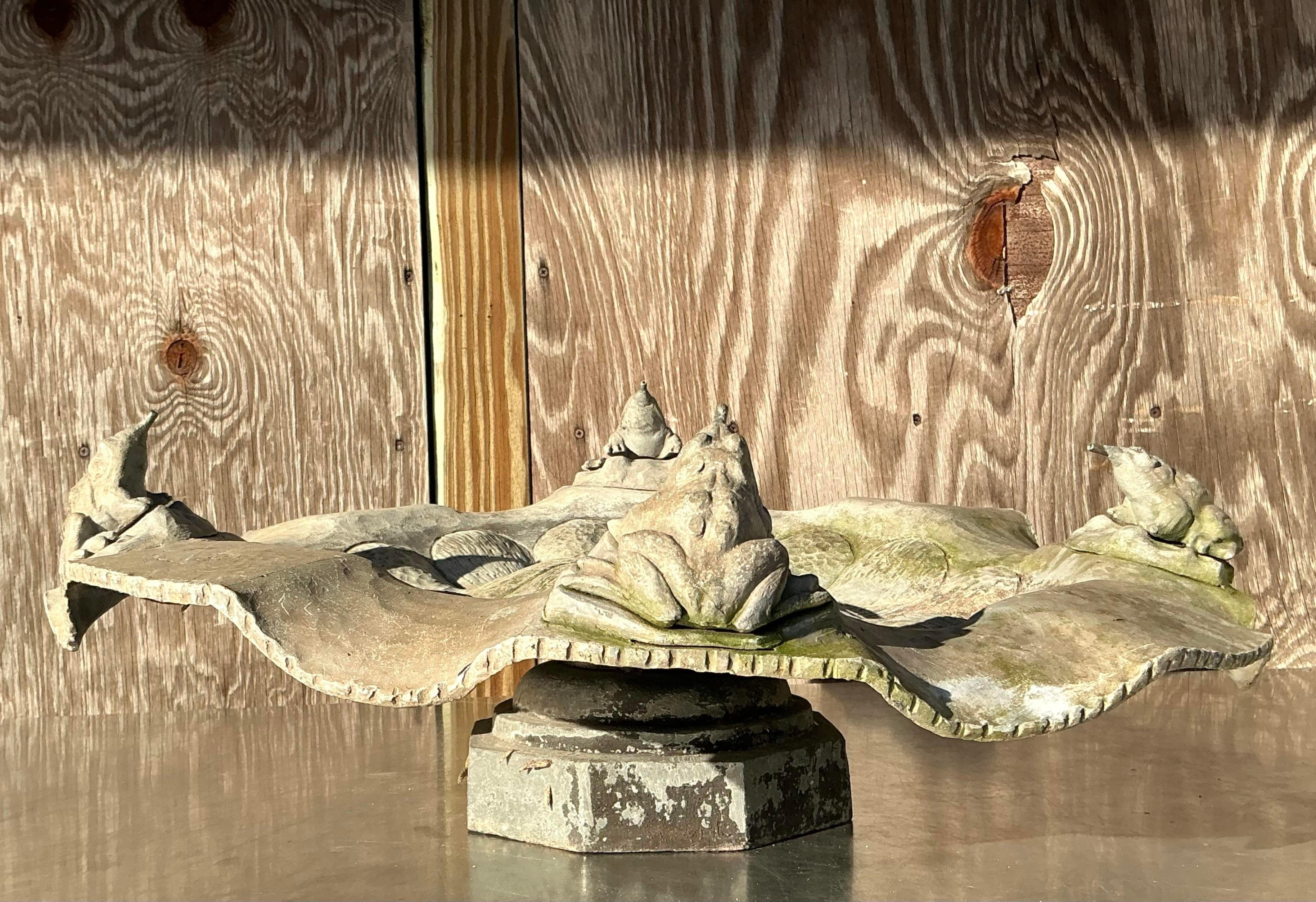 This vintage lead frog fountain features an intricately detailed design with charming frog sculptures encircling a textured basin. The piece is crafted from solid lead, offering durability and a timeless aesthetic. Perfect for creating a serene,