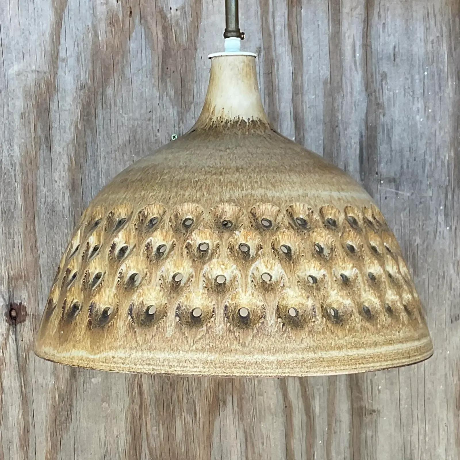Fabulous vintage Matte glazed pottery chandelier. Made by the iconic Leo Rosen of Design Technics. Beautiful neutral colors and perforated design. Acquired from a Palm Beach estate.