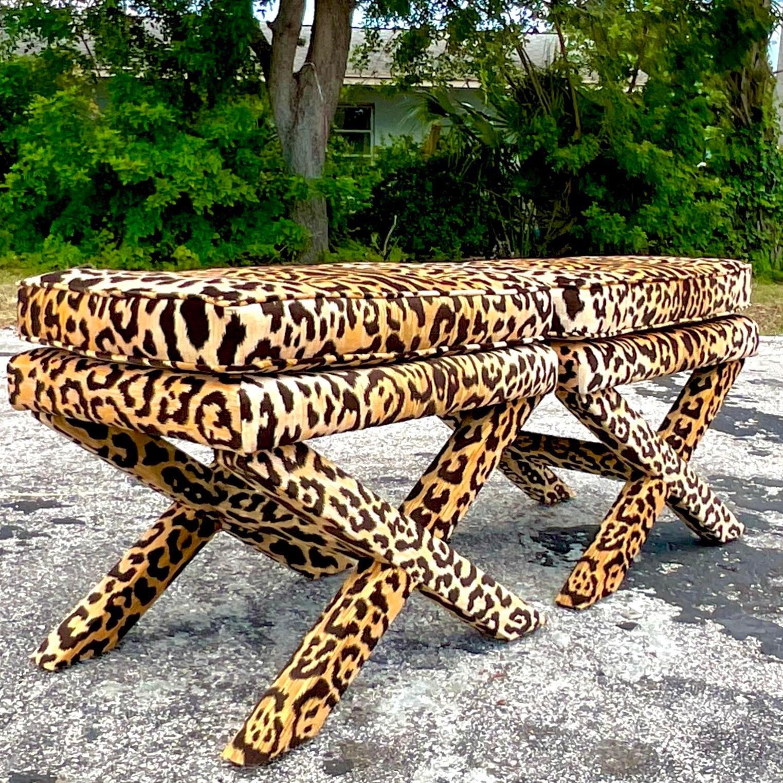A fabulous pair of vintage Boho X Benches. A chic classic shape upholstered in a gorgeous leopard velvet. Beautiful tufted detail. Acquired from a Palm Beach estate. 