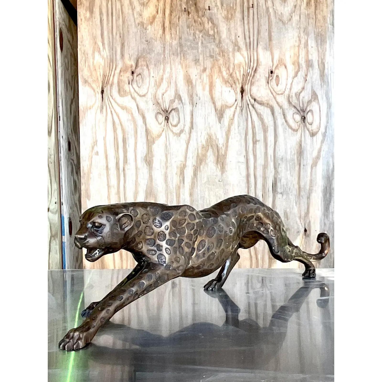 Incredible vintage Boho Cheetah sculpture. A chic composition with amazing attention to detail. Perfect indoors or out. Acquired from a Palm Beach estate.