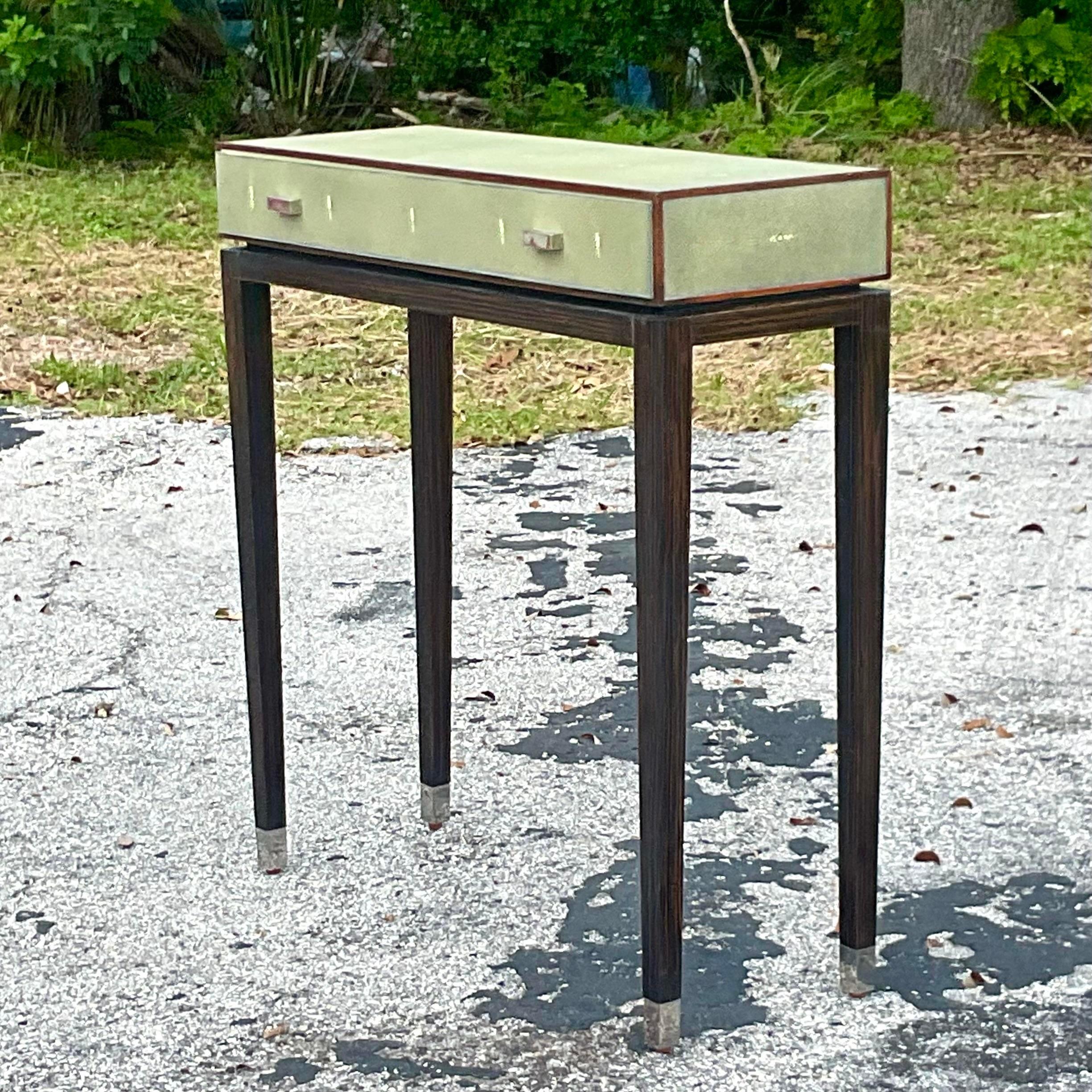 A fabulous vintage Boho console table. Made by the iconic Lillian August for Hickory White. Beautiful faux Shagreen cabinet with a chic ebony pedestal. The console is not too deep so it makes it perfect for those narrow spaces. Acquired from a Palm