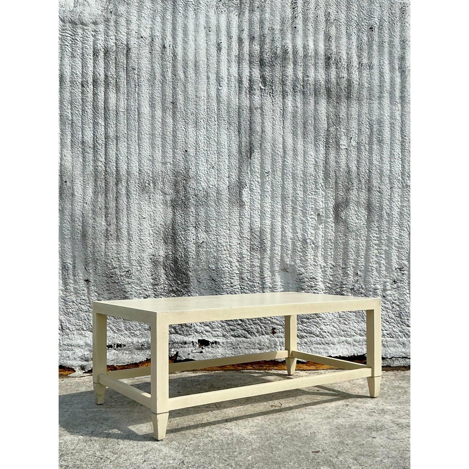 Add a touch of bohemian elegance to your space with this Vintage Boho Made Goods “Jarin” Grasscloth Coffee Table, a perfect blend of organic texture and timeless design. Expertly crafted with a grasscloth finish, this piece exudes natural charm, its