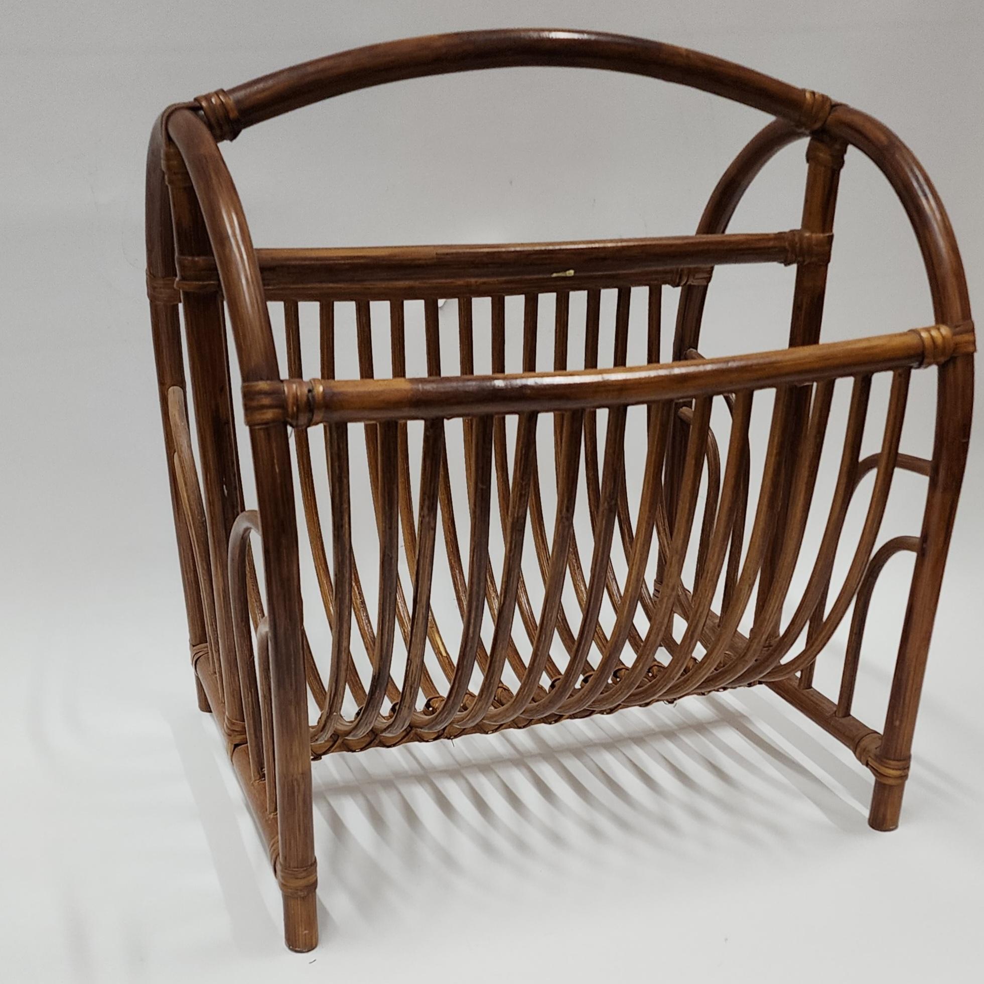 Vintage Boho Bamboo Rattan magazine rack.  bamboo and cane joints all in good shape.  goes great with several styles, boho and Hollywood as well as the vintage esthetic. 