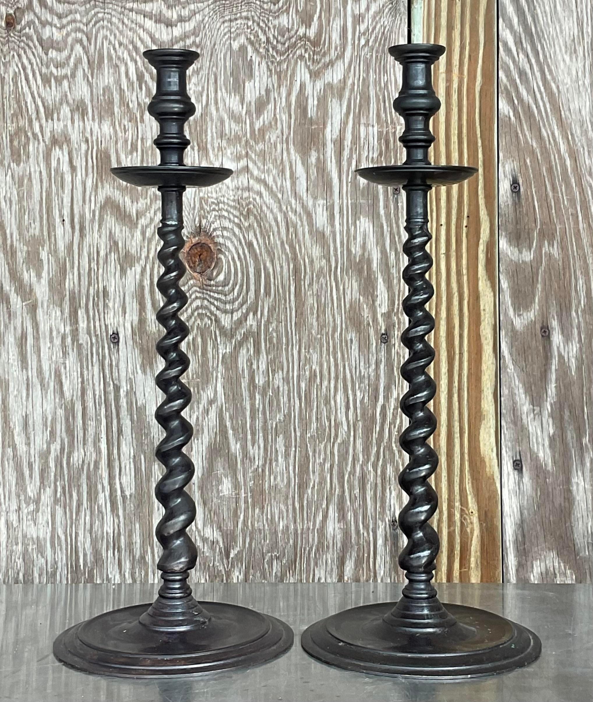A fabulous pair of vintage Boho candlesticks. A chic barley twist design with a patinated bronze finish. Made by the iconic Maitland Smith group and tagged on the bottom. Acquired from a Palm Beach estate. 