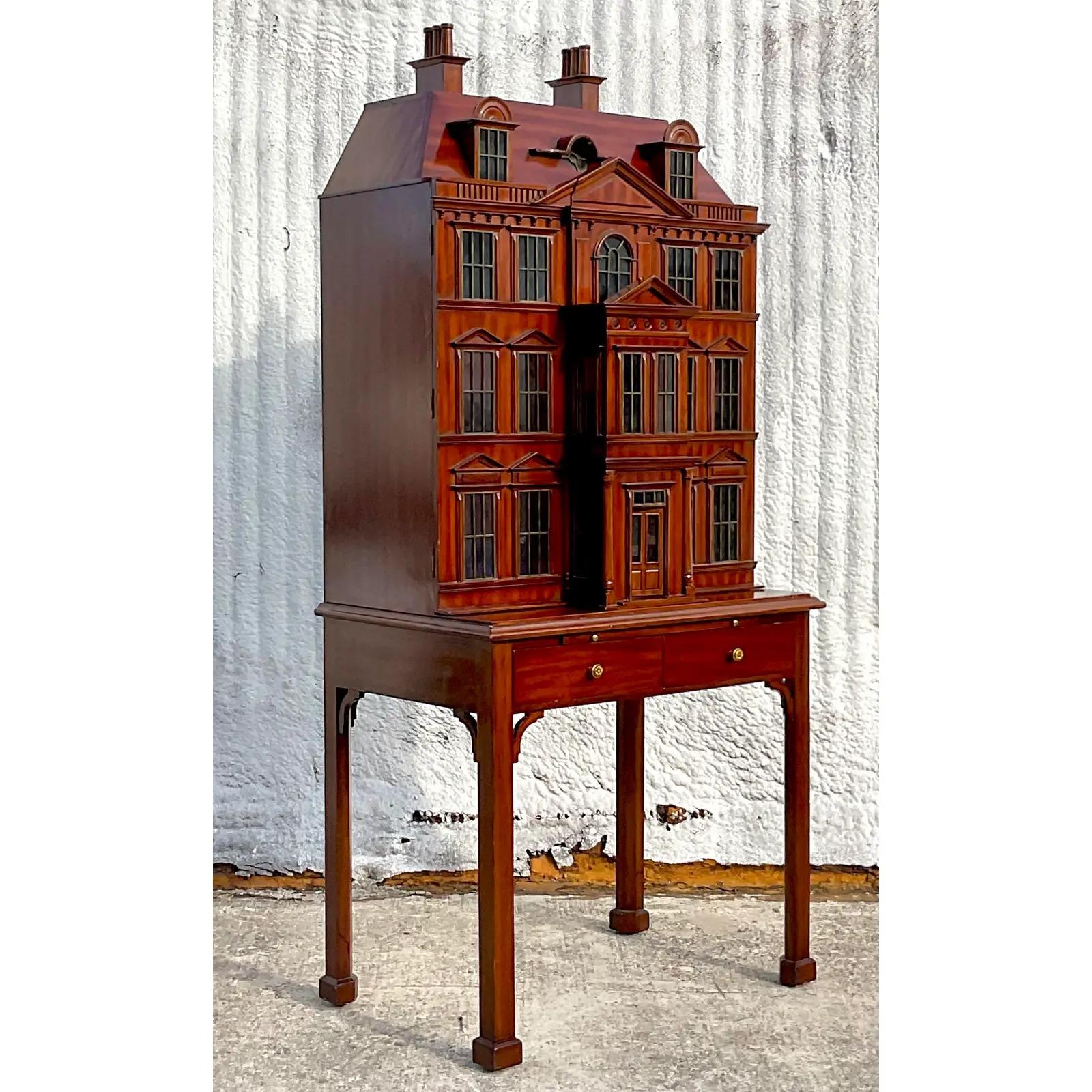An exceptional vintage Maitland Smith dry bar. Part of their highly coveted Dollhouse collection. Brass mullion windows and peaked windows make this a super special collectors pieces. Two interior shelves. (Not pictured). Acquired from a Palm Beach