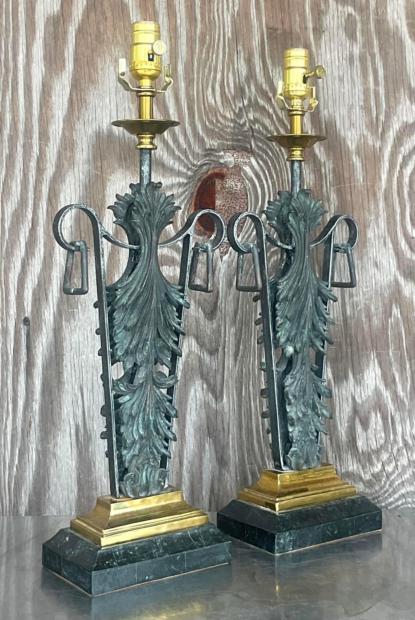 A fabulous pair of vintage Boho table lamps. A chic patinated Fleur de Lys design. Made by the iconic Maitland Smith and tagged on the bottom. Fully restored with all new wiring and hardware. Acquired from a Palm Beach estate. 