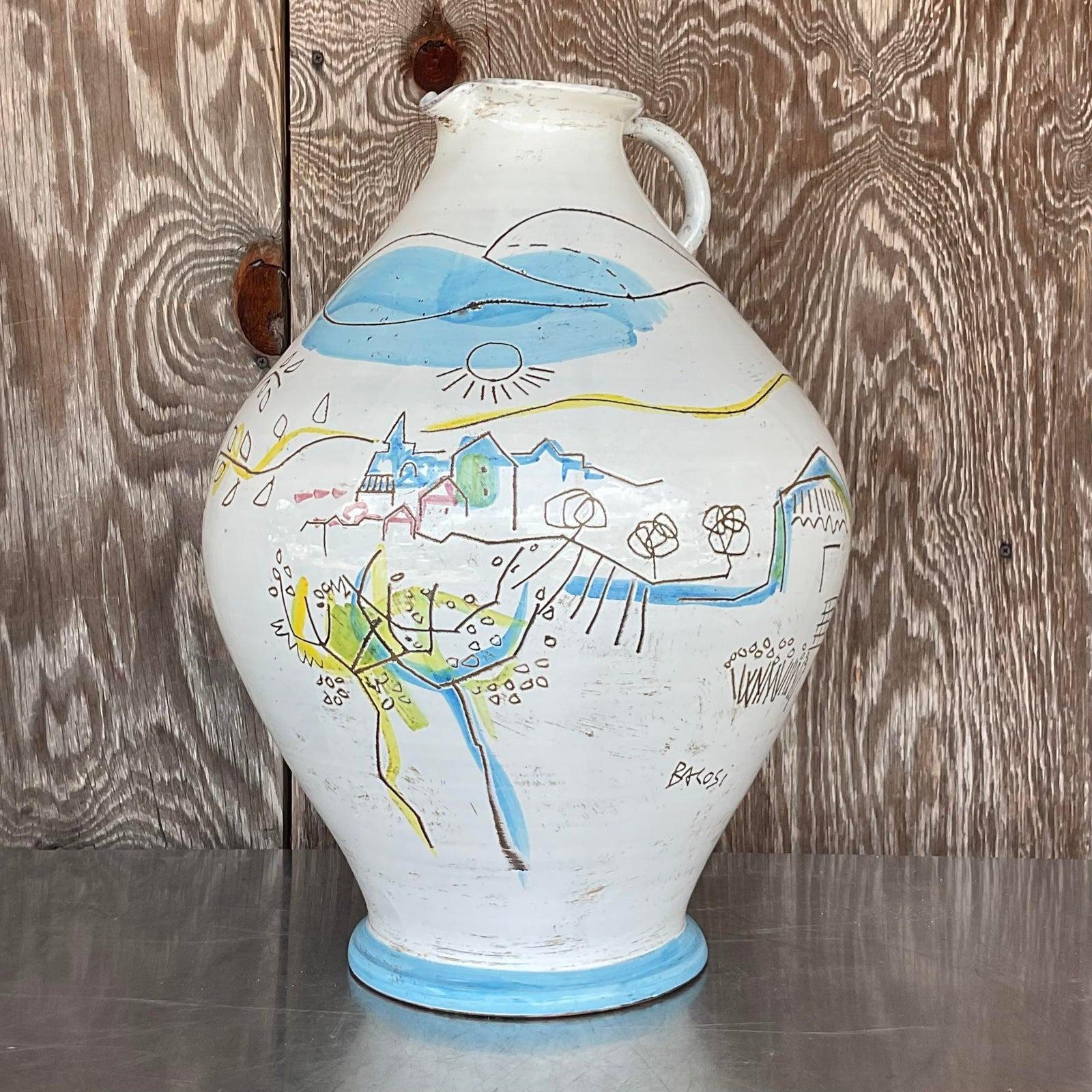 A fabulous vintage Italian Art pottery jug. Done by the highly collectible Manlio Bacosi. Signed on the vase. A beautiful pastoral scene in bright clear colors. Acquired from a Palm Beach estate