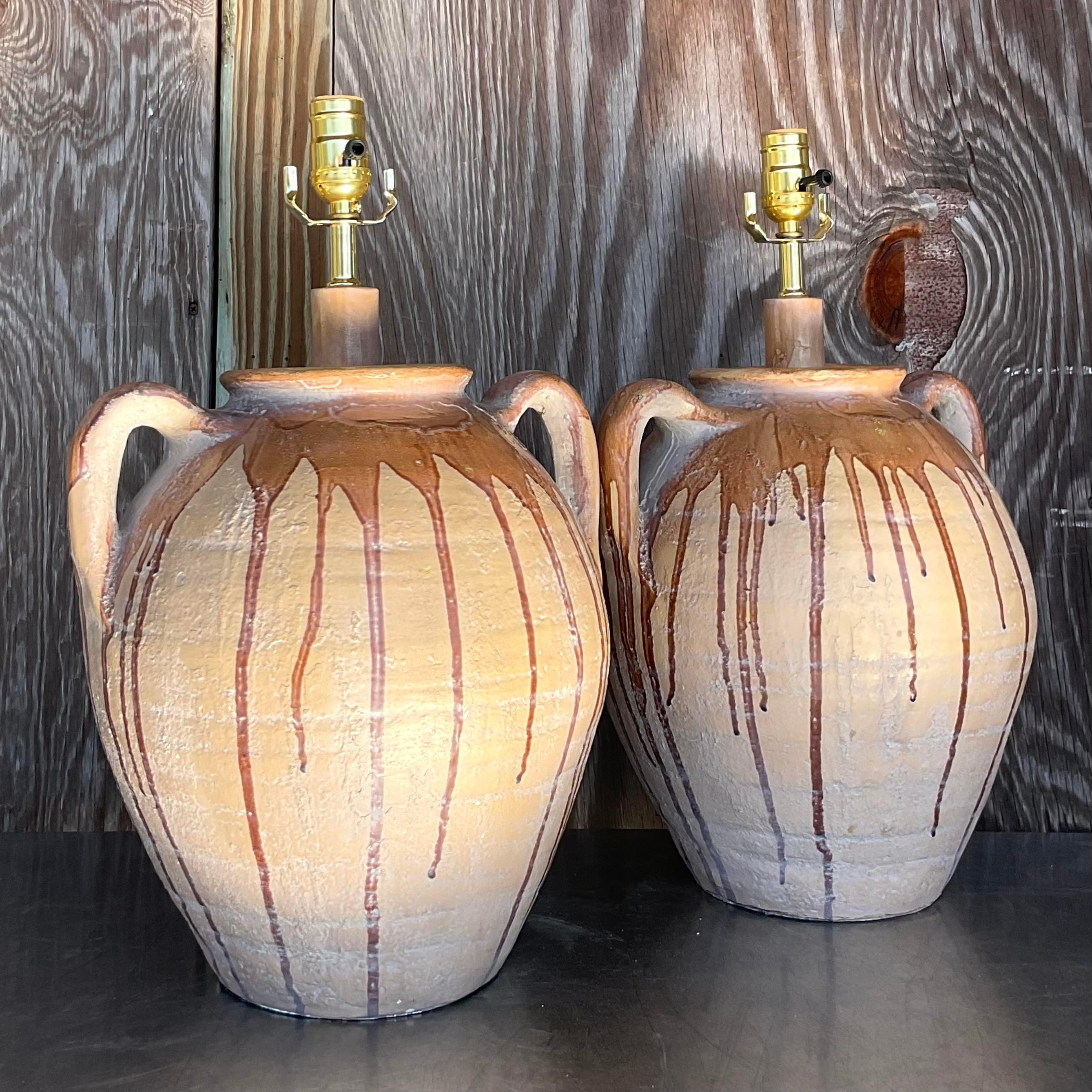 A fabulous pair of vintage Boho table lamps. A chic matte finish with a fab drip glaze. Warm neutral colors. Fully restored with all new wiring and hardware. Acquired from a Palm Beach estate.