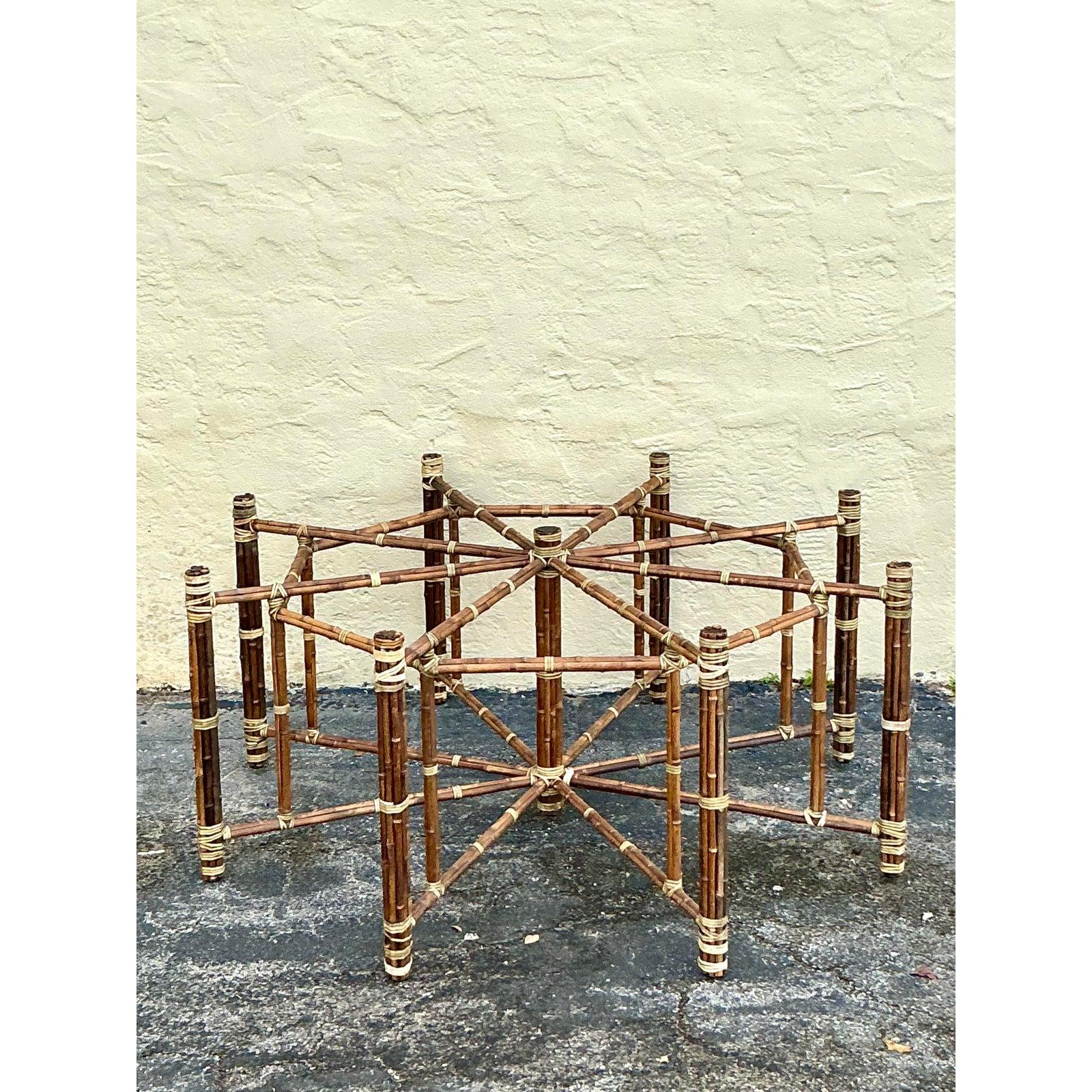 Anchor your dining room with the architectural sophistication of this monumental vintage bundled rattan table base, designed in the sought-after style of McGuire San Francisco. This striking pedestal features a complex, geometric construction of