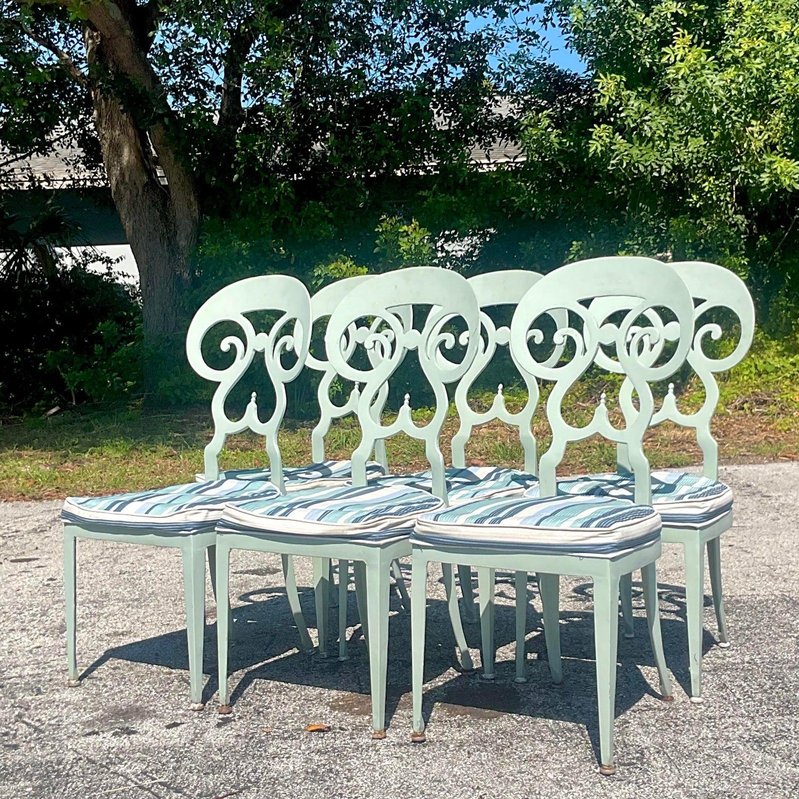 A fabulous set of 6 vintage Boho dining chairs. A chic metal frame with a scroll design. Done in the manner of Biedermeier. Acquired from a Palm Beach estate.